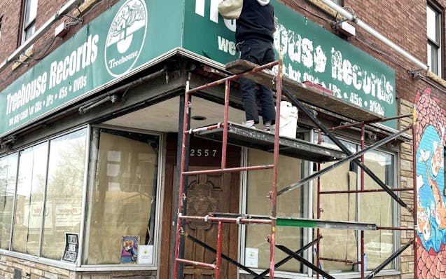 Work began this week on the sign above the former Treehouse Records space, soon to be reopened as Lucky Cat Records.