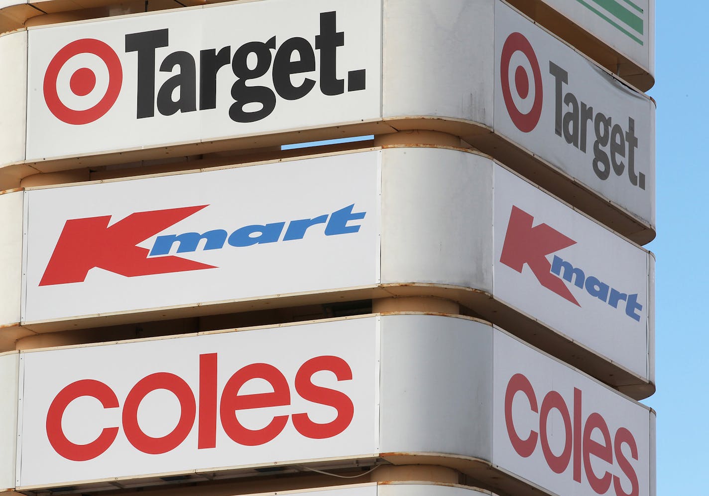 The Target Corp., Kmart and Coles logos are displayed on a sign in Perth, Australia, on Monday, July 26, 2010. Wesfarmers Ltd., Australia's second-largest retailer, said sales at its Coles unit rose in the fourth quarter as the division's convenience stores and revamped fresh food areas in supermarkets drew more customers. Photographer: Tony Ashby/Bloomberg ORG XMIT: 102967514