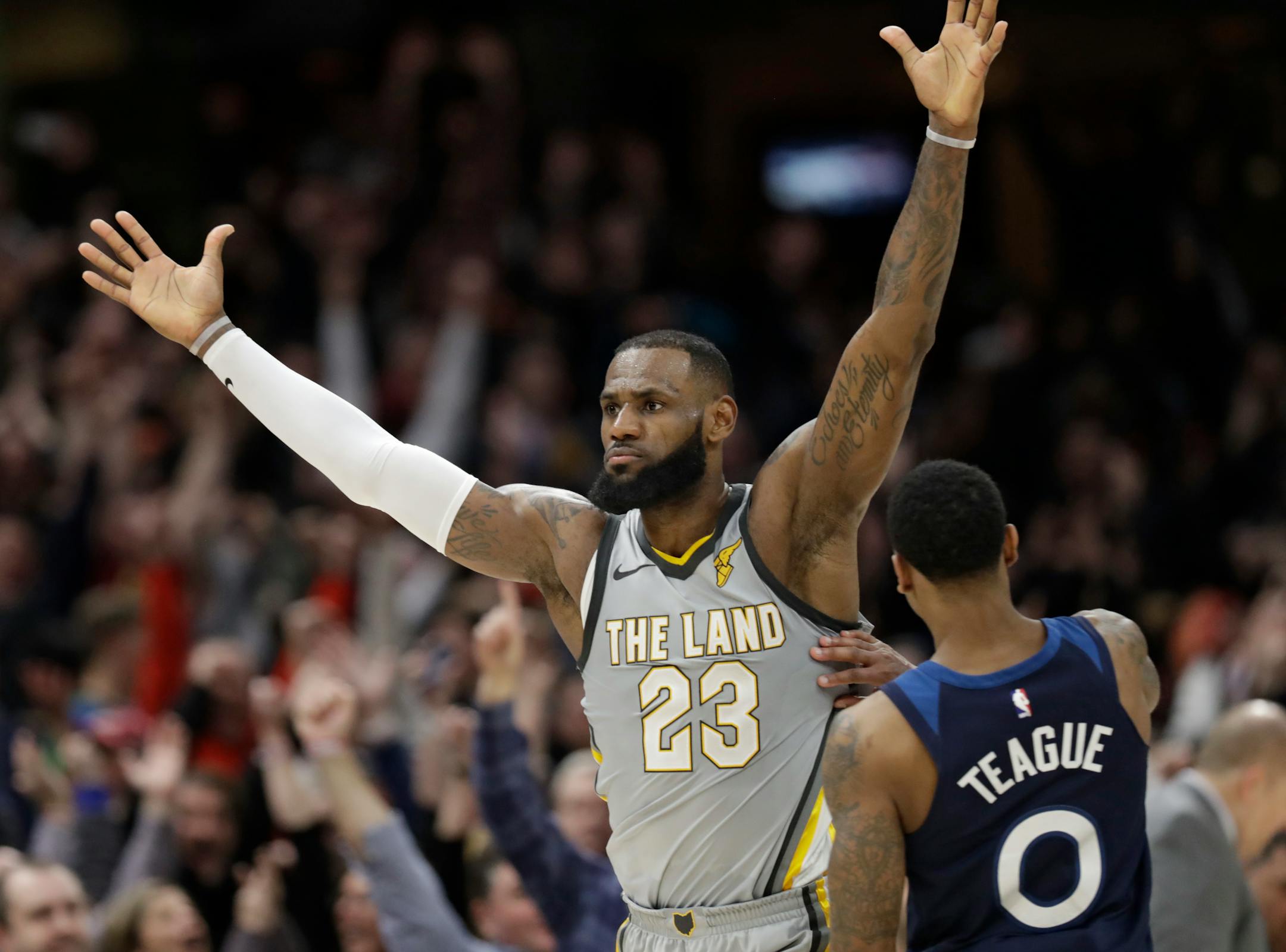 Cleveland Cavaliers' LeBron James, left, celebrates after making the game-winning basket in overtime in an NBA basketball game against the Minnesota Timberwolves, Wednesday, Feb. 7, 2018, in Cleveland. The Cavaliers won 140-138 in overtime. (AP Photo/Tony Dejak)