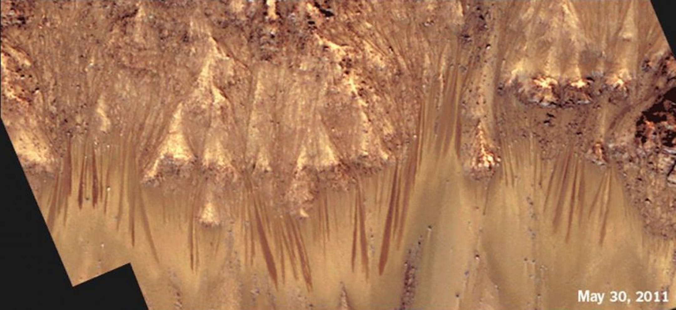 A time-lapse animation of Palikir Crater shows how the streaks extend and darken during warmer months on Mars, then gradually fade as temperatures cool. Image date May 30, 2011