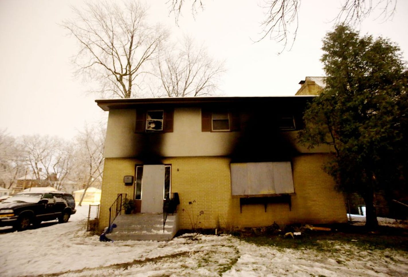 The charred exterior of a house on the 2100 block of Emerson Ave. N. where one person is dead following an overnight blaze and seen Wednesday, Nov. 23, in Minneapolis, MN.