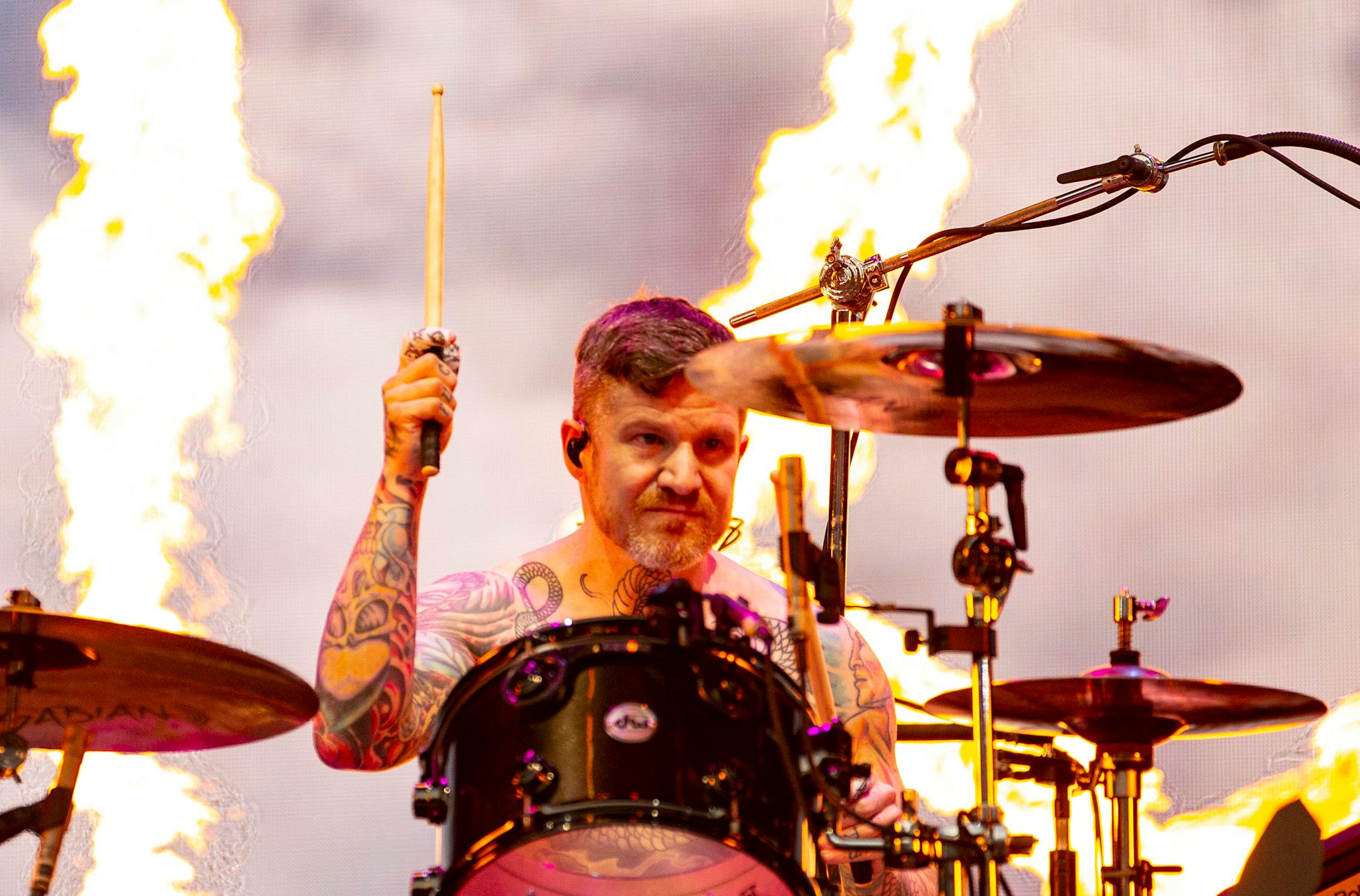 Andy Hurley, drummer, for Fall Out Boy, played as flames shot out around him during the band's opening song at the Hella Mega Tour at Target Field in Minneapolis on Monday.