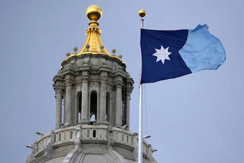 The Minnesota state flag flies amid strong winds as the Minnesota Legislature heads into the final weekend of its 2025 session on May 16, 2025, at the State Capitol in St. Paul, Minnesota.