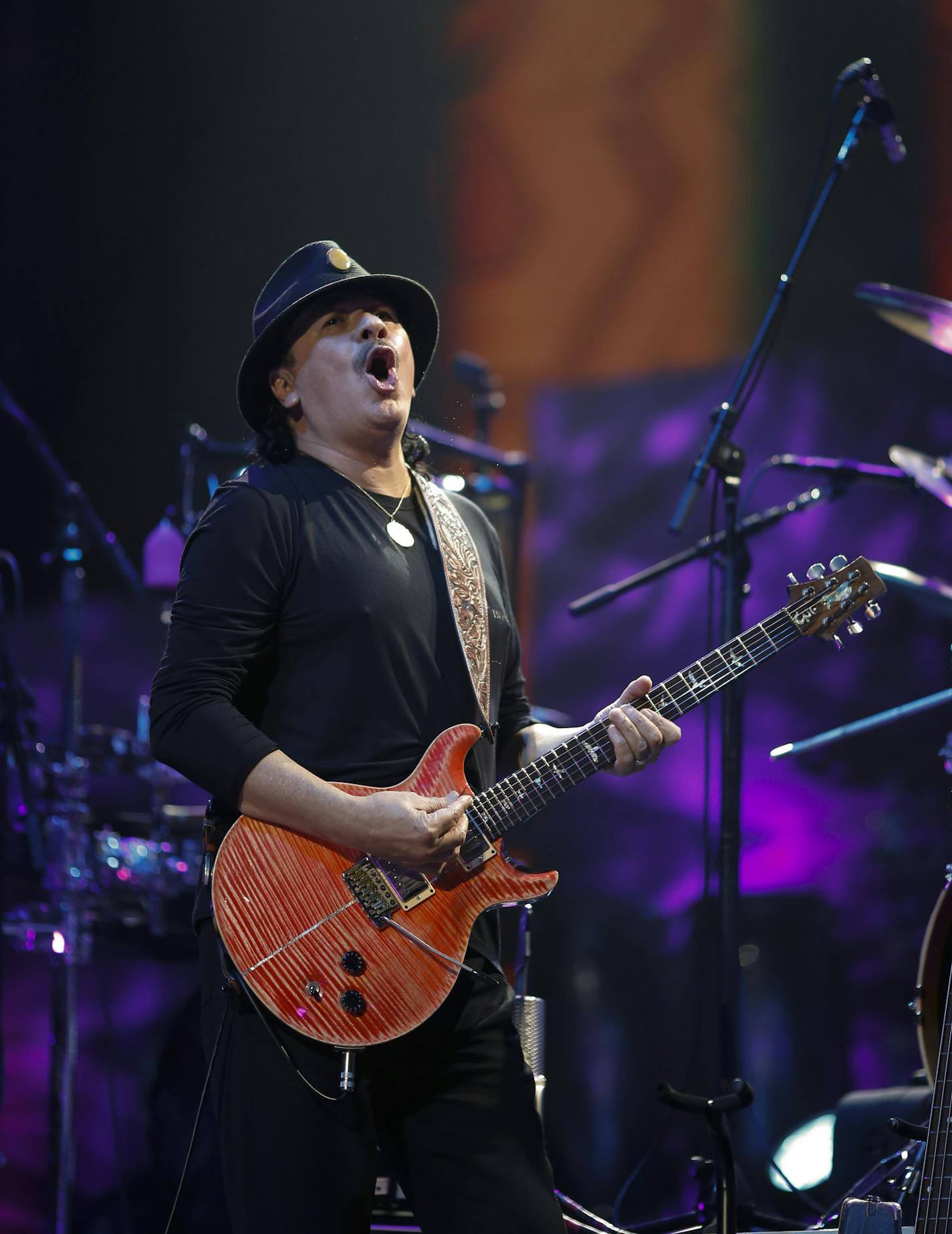 Carlos Santana early in his set Sunday night at Xcel Energy Center. ] JEFF WHEELER &#xe2;&#x20ac;&#xa2; jeff.wheeler@startribune.com Carlos Santana and Rod Stewart performed Sunday night, August 10, 2014 at Xcel Energy Center in St. Paul.