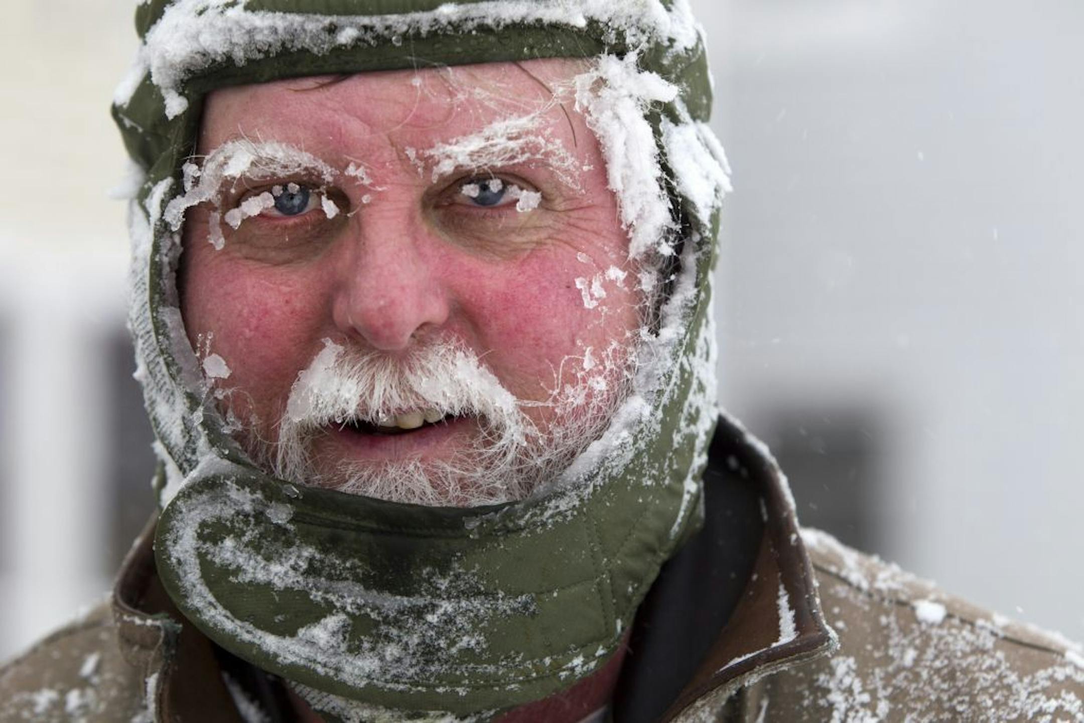 Ice clings to Ken Anderson's eyebrows and mustache as he uses a snowblower during a blizzard, Saturday, Feb. 9, 2013, in Portland, Maine. The storm dumped more than 30 inches of snow as of Saturday afternoon, breaking the record for the biggest storm on record. (AP Photo/Robert F. Bukaty) ORG XMIT: MIN2013020918110482