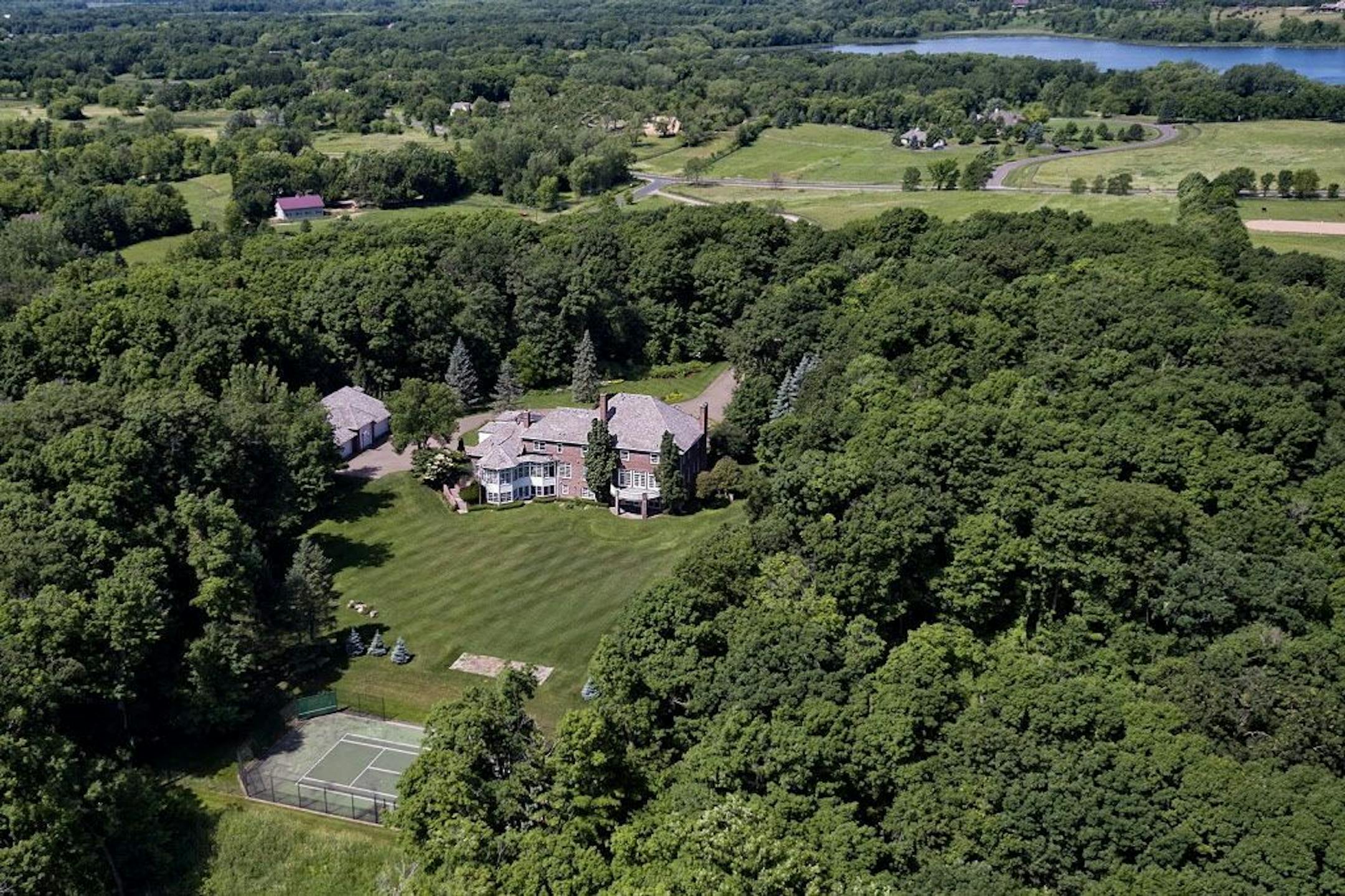 Another aerial view of the 40-acre property which includes a tennis court.