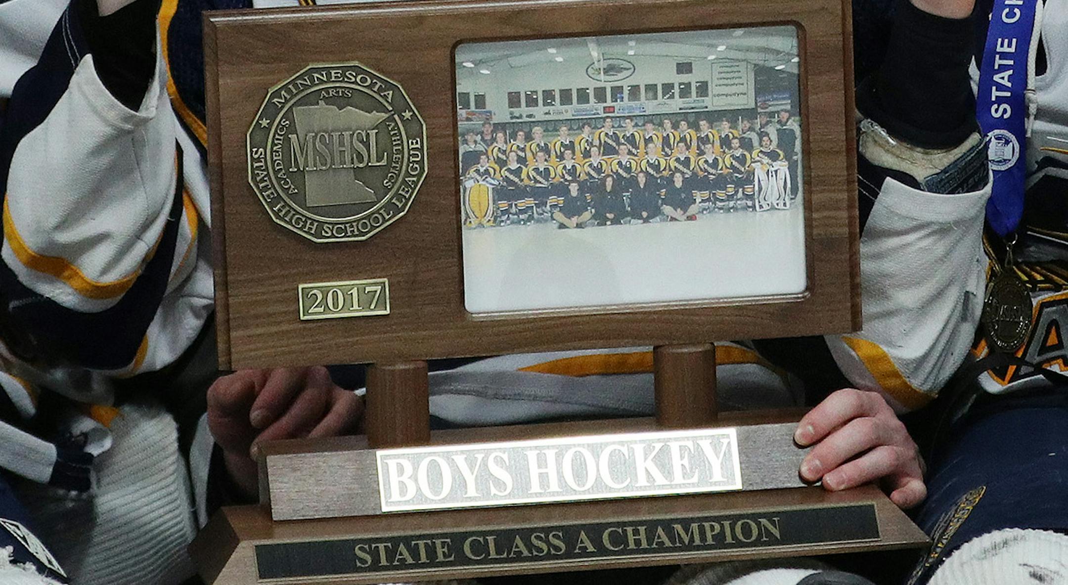 Hermantown pose for a photo with their first place trophy on the ice. ] ANTHONY SOUFFLE • anthony.souffle@startribune.com Players competed during the boys' hockey state tournament Class 1A championship game Saturday, March 11, 2017 at the Xcel Energy Center in St. Paul, Minn. ORG XMIT: MIN1703111647260060