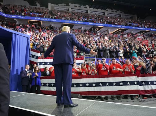 President Donald Trump greeted cheering crowds at the Target Center in Minneapolis, Minnesota.