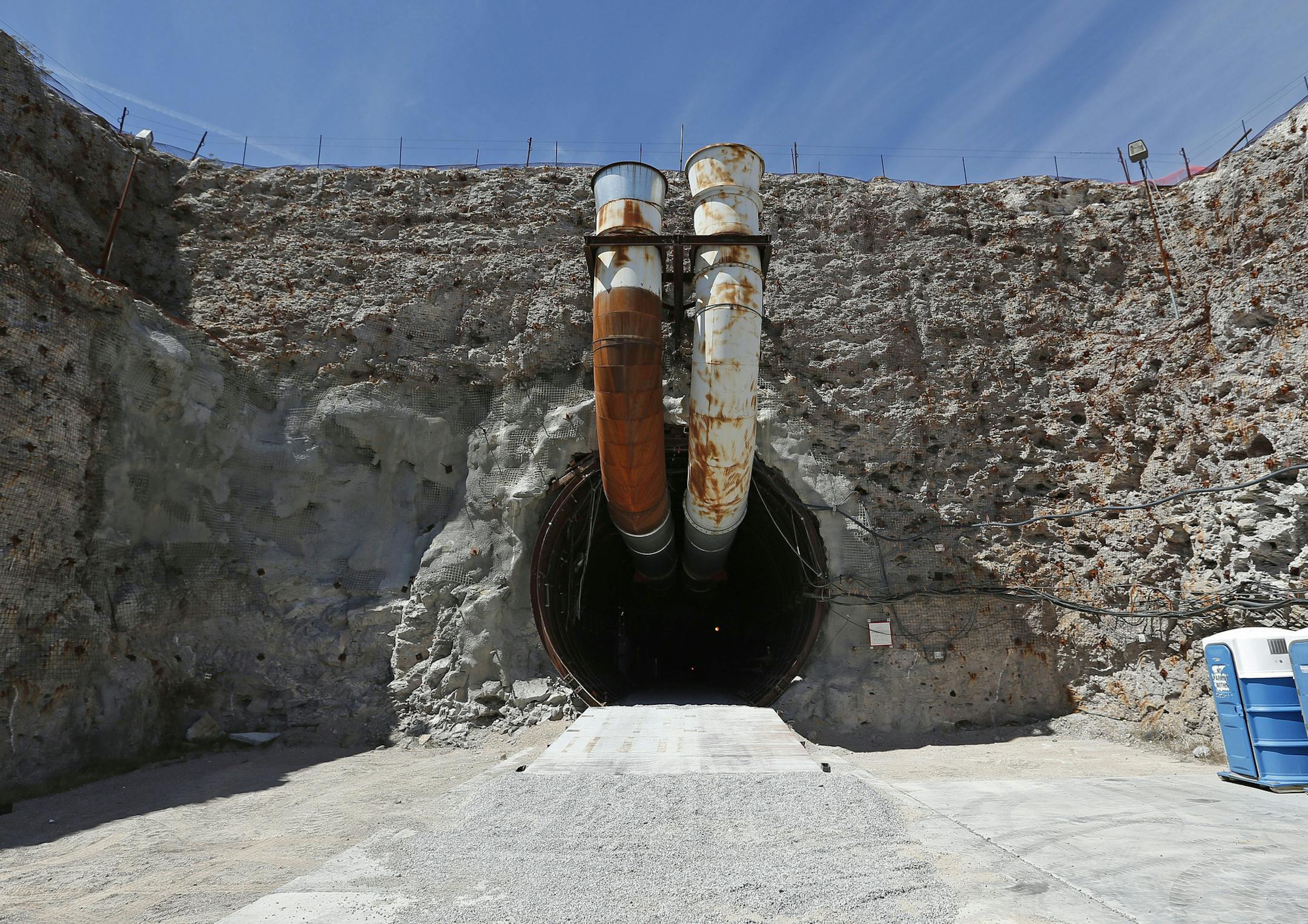 FILE - This April 9, 2015, file photo shows the south portal of the proposed Yucca Mountain nuclear waste dump near Mercury, Nev. Facing a new presidential administration and a Republican-controlled Congress without now retired Sen. Harry Reid, Nevada officials are gearing up to resume a 30-year fight to stop a federal proposal to bury the nation's nuclear waste about 100 miles northwest of Las Vegas though some local officials who live near the site aren't on the same page. (AP Photo/John Loche