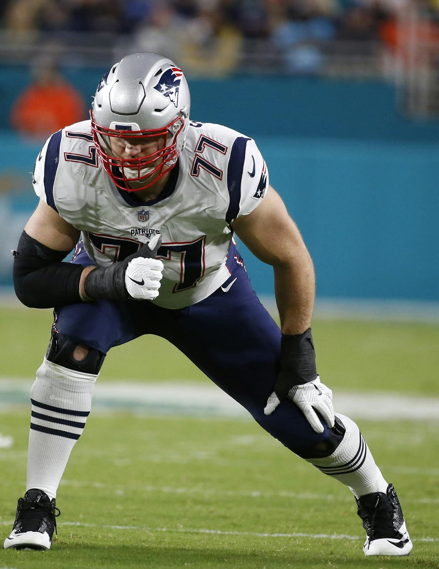 New England Patriots offensive tackle Nate Solder (77) gets ready to play, during the second half of an NFL football game against the Miami Dolphins, Monday, Dec. 11, 2017, in Miami Gardens, Fla. (AP Photo/Wilfredo Lee) ORG XMIT: OTK