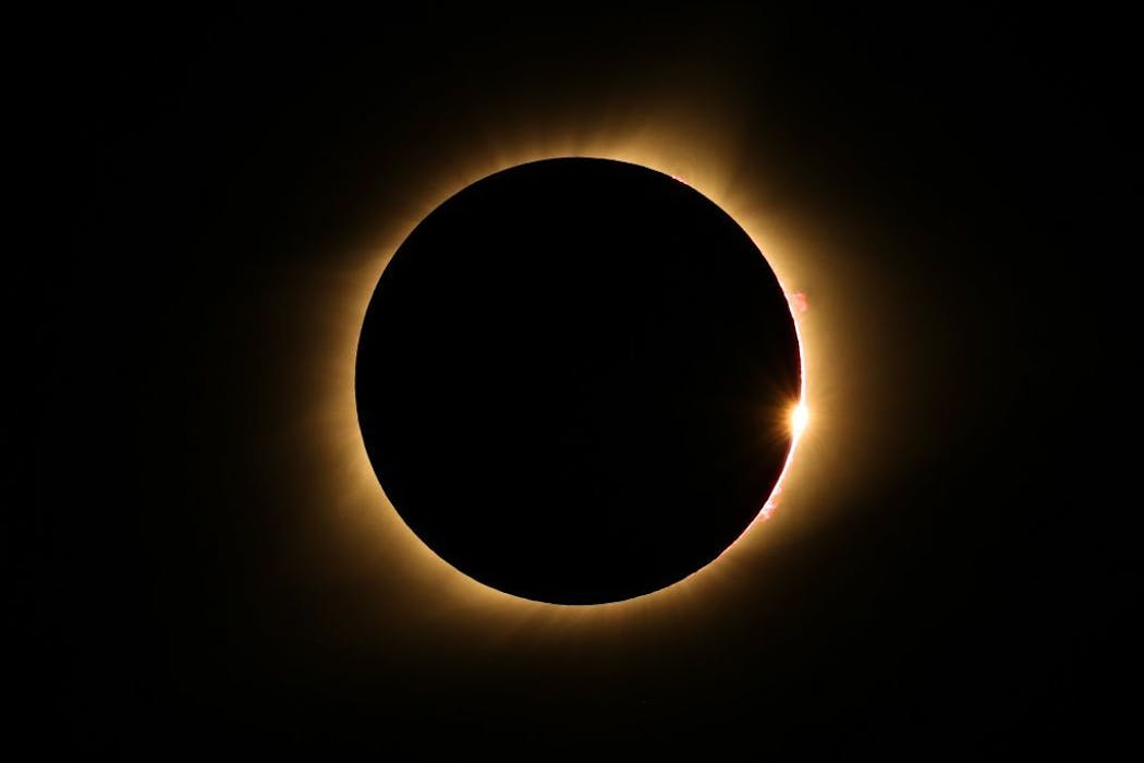 The moon passes in front of the sun for a total solar eclipse in 2017, visible from Farmington, Mo.