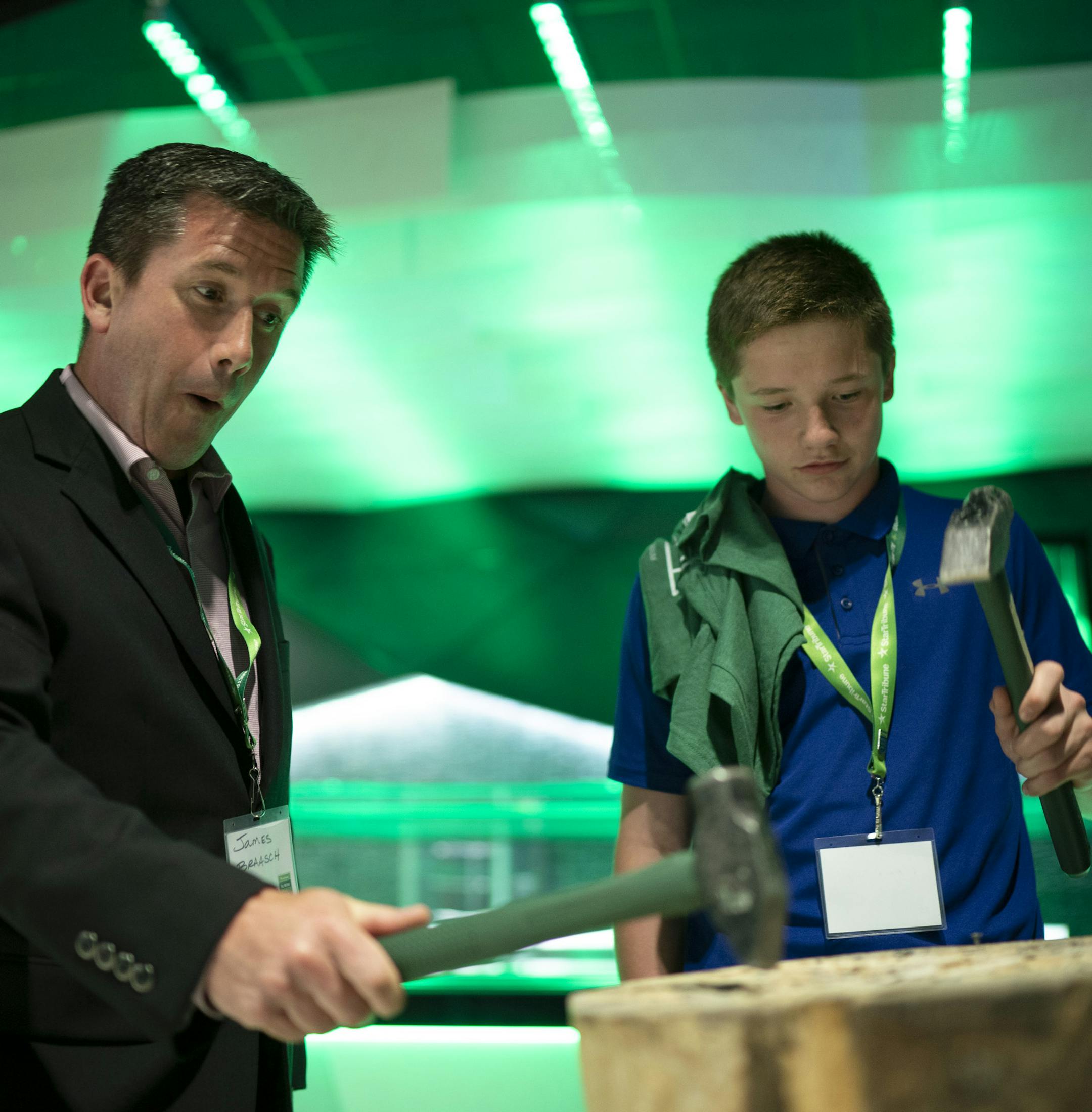 Spencer Braasch tried his skill at a test of nail pounding skill with his uncle, James Braasch. ] JEFF WHEELER • jeff.wheeler@startribune.com The second annual Star Tribune All-Metro Sports Awards were announced Tuesday night, June 25, 2019 at a banquet at U.S. Bank Stadium.