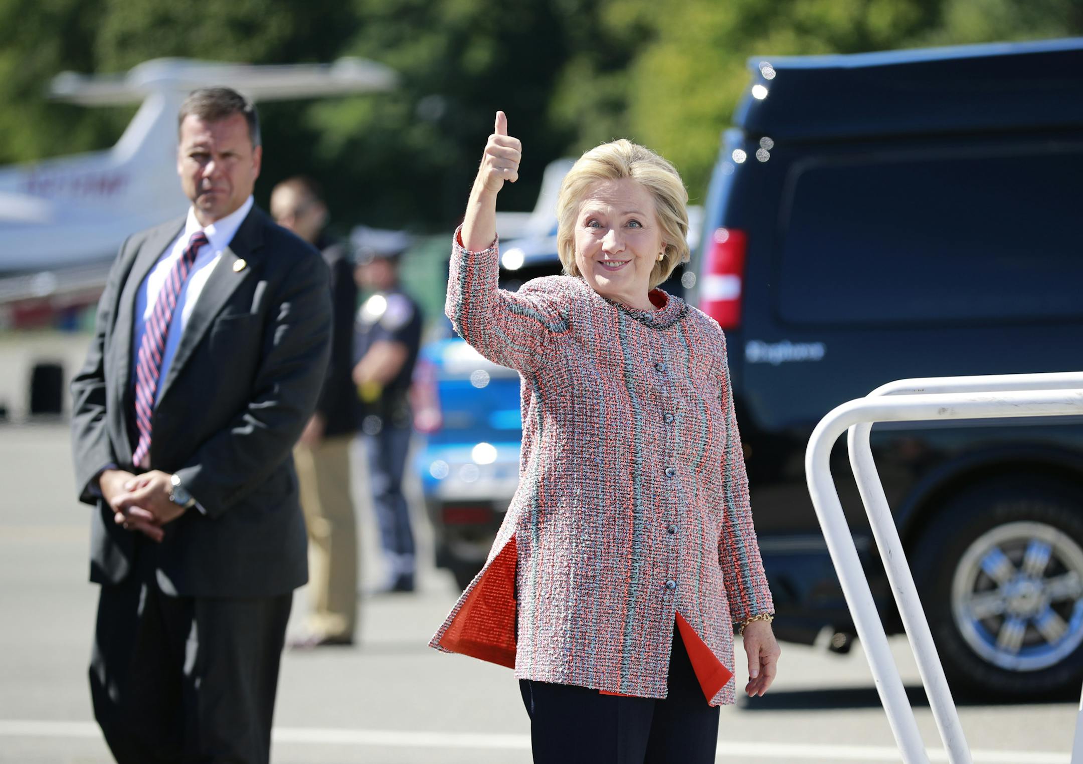 Hillary Clinton, the Democratic presidential nominee, gives a thumbs up as she boards her campaign plane in White Plains, N.Y., Sept. 15, 2016. Clinton returned to the campaign trail Thursday after contracting a “mild, noncontagious” form of pneumonia diagnosed last Friday, two days before she was seen losing her footing while leaving a ceremony for the 15th anniversary of the 9/11 terrorist attacks. (Doug Mills/The New York Times)
