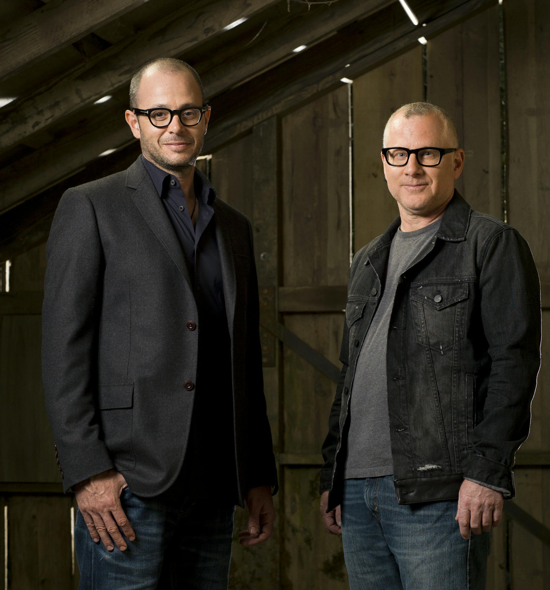 Damon Lindelof, left, and Tom Perrotta, the creators of the HBO series "The Leftovers," based on Perrotta's novel, on the Warner Bros. back lot in Burbank, Calif., May 6, 2014. "The Leftovers," is a family drama examining faith and grief in a post-apocalyptic tableau. (Sam Comen/The New York Times) -- PHOTO MOVED IN ADVANCE AND NOT FOR USE - ONLINE OR IN PRINT - BEFORE MAY 25, 2014.
