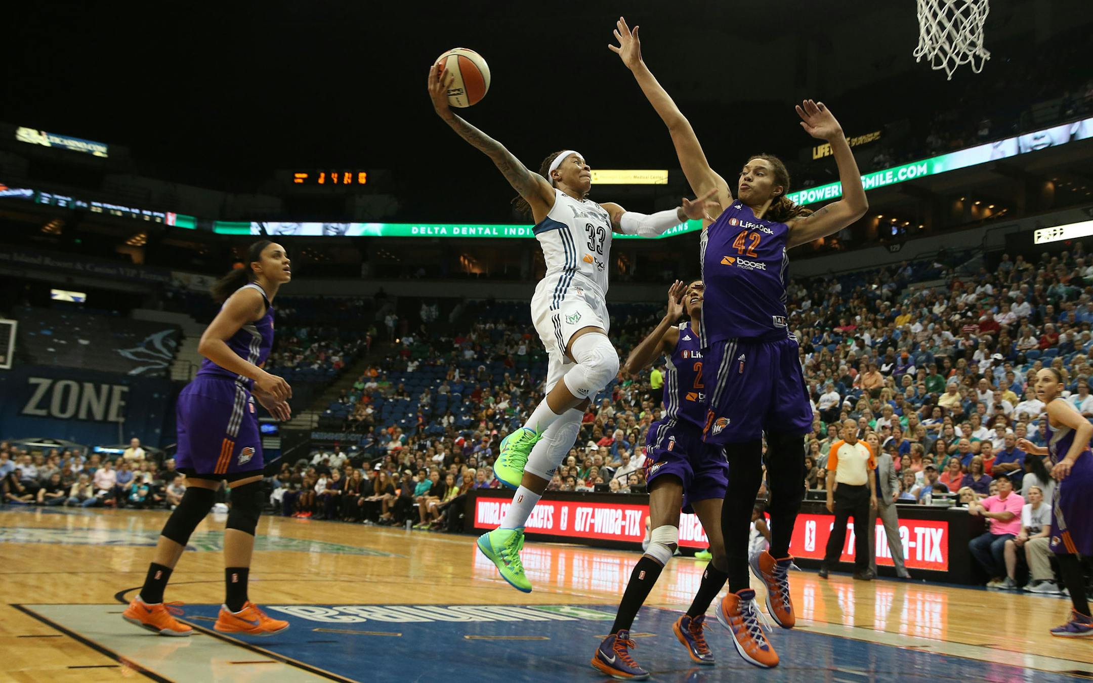 Minnesota forward Seimone Augustus (33) went up for a layup with Phoenix center Brittney Griner (42) defending during the second half of the first game in the WNBA Western Conference Finals at Target Center in Minneapolis, Thursday September 26, 2013. Lynx won over Mercury 85-62. ] (KYNDELL HARKNESS/STAR TRIBUNE) kyndell.harkness@startribune.com