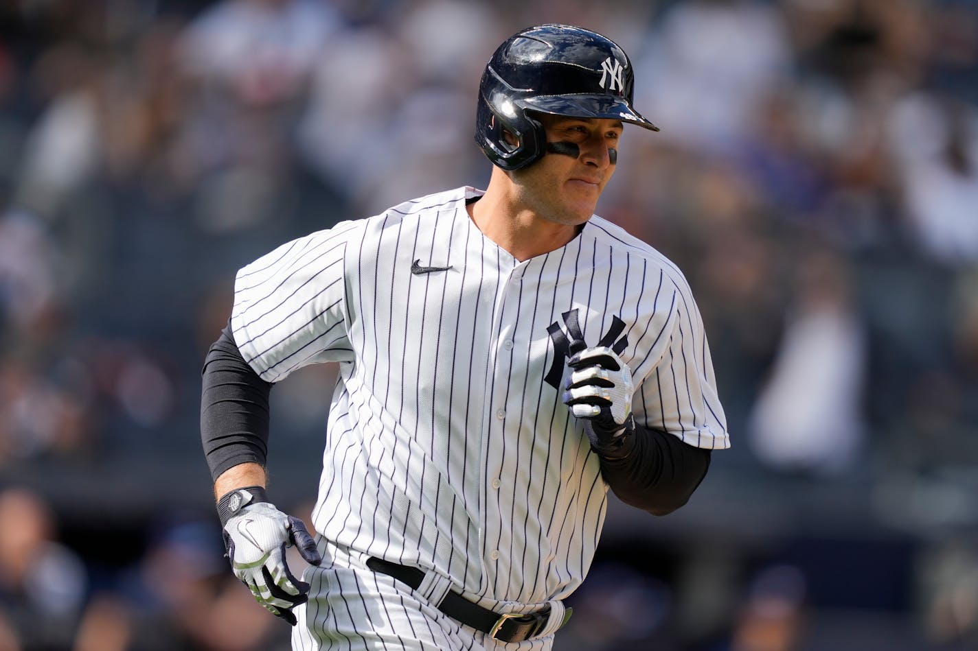 New York Yankees' Anthony Rizzo hits a solo home run off Toronto Blue Jays relief pitcher Adam Cimber (90) in the ninth inning of a baseball game, Sunday, April 23, 2023, in New York. (AP Photo/John Minchillo)