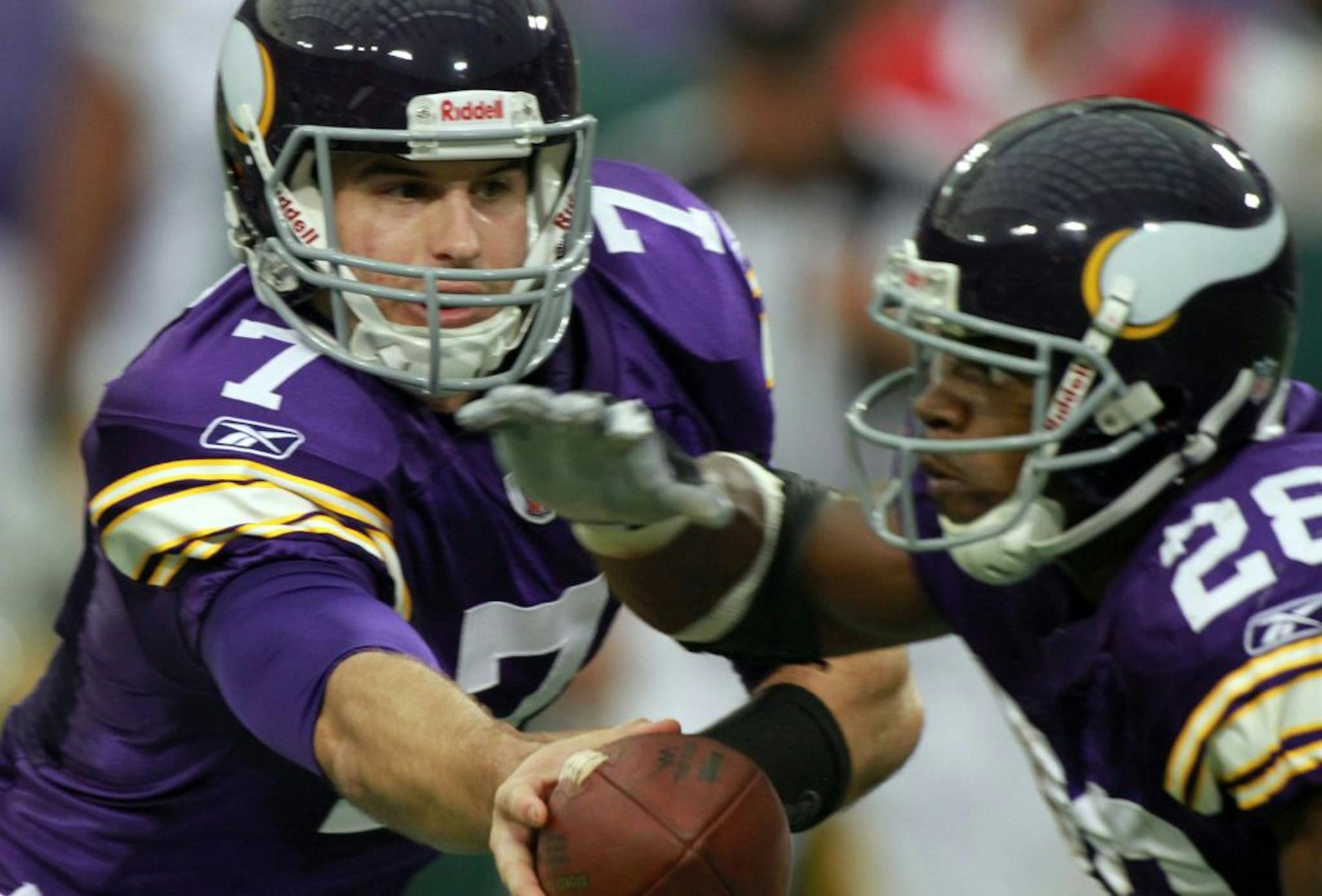 Vikings quarterback Christian Ponder handed off the ball to running back Adrian Peterson against the Green Bay Packers at Mall of America Field on October 23, 2011. The Green Bay Packers defeated the Minnesota Vikings 33-27.