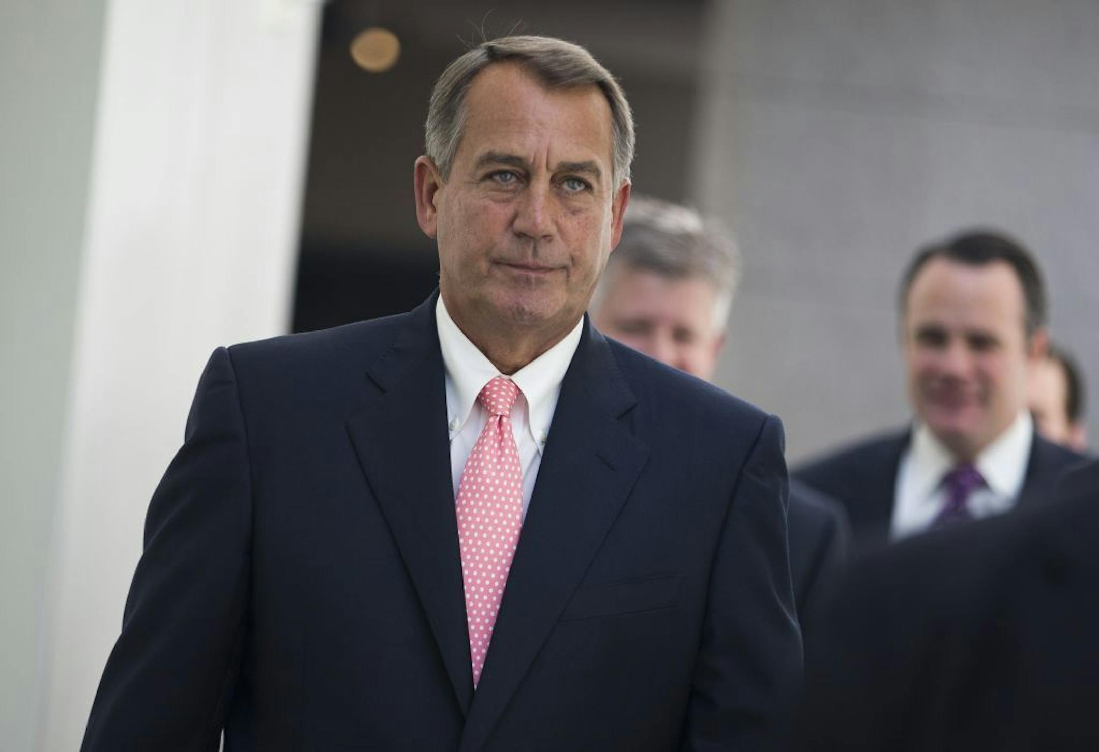 House Speaker John Boehner of Ohio walks to a House Republican Conference meeting to discuss the ongoing budget fight, Monday, Sept. 30, 2013, on Capitol Hill in Washington.
