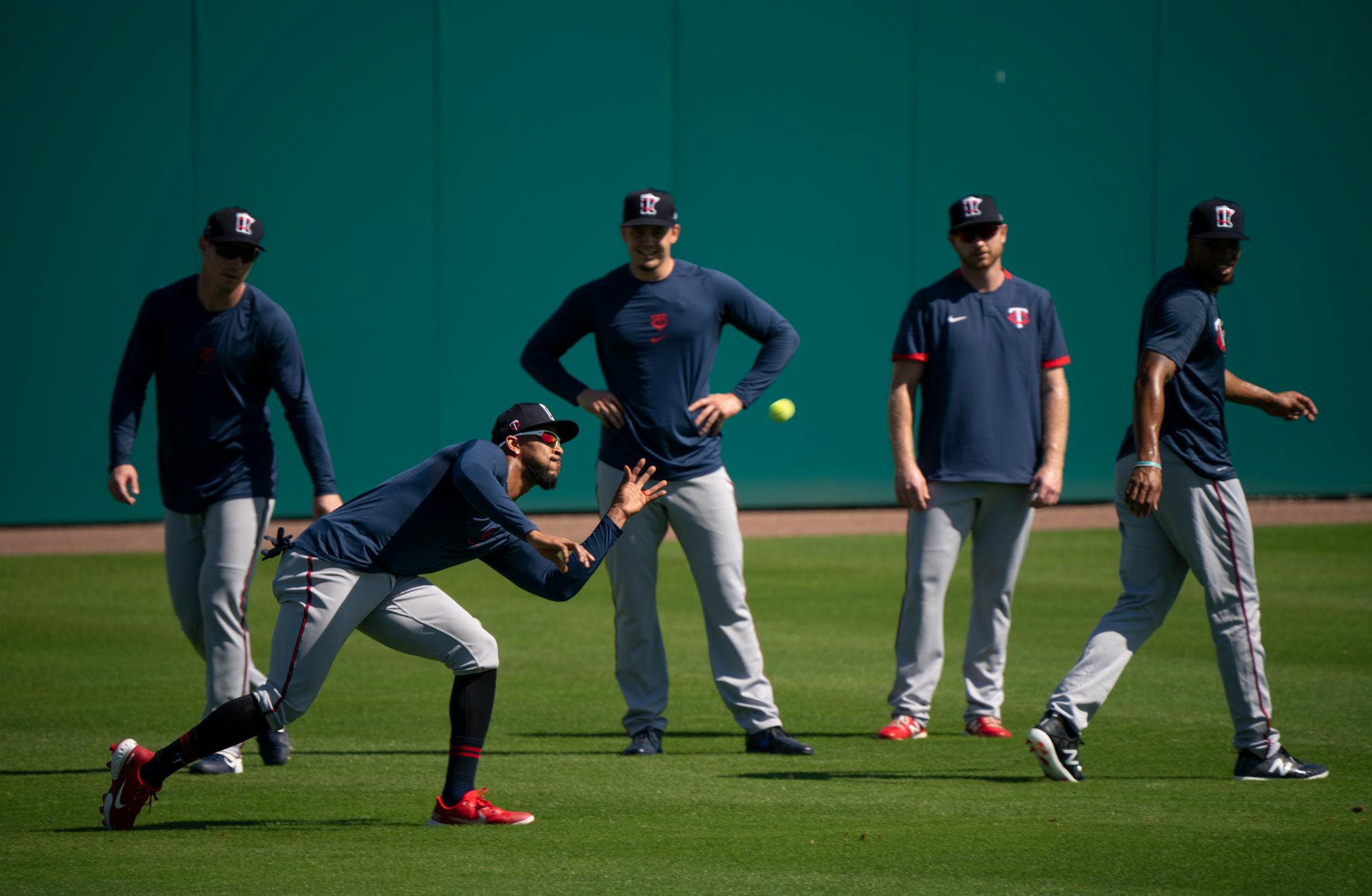 Minnesota Twins center fielder Byron Buxton fielded a ball during a drill where outfielders fielded tennis balls with their bare hands.
