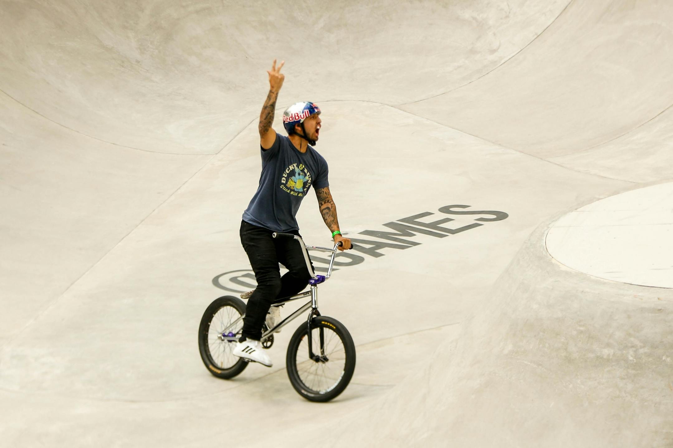 Daniel Sandoval celebrates after landing successfully during Dave Mirra's BMX Park Best Trick at the X Games at U.S. Bank Stadium Sunday, August 4, 2019.