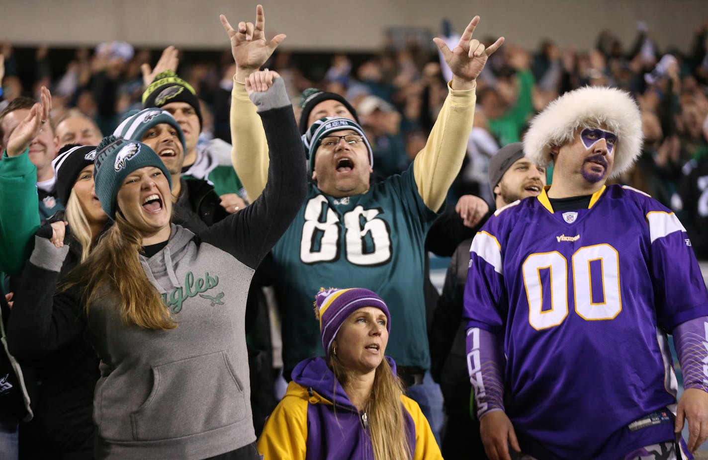 Mike Brown, right, and Jodie Brown, foreground, from St. Paul, looked dejected as Eagles fans celebrated around them during the NFC Championship game