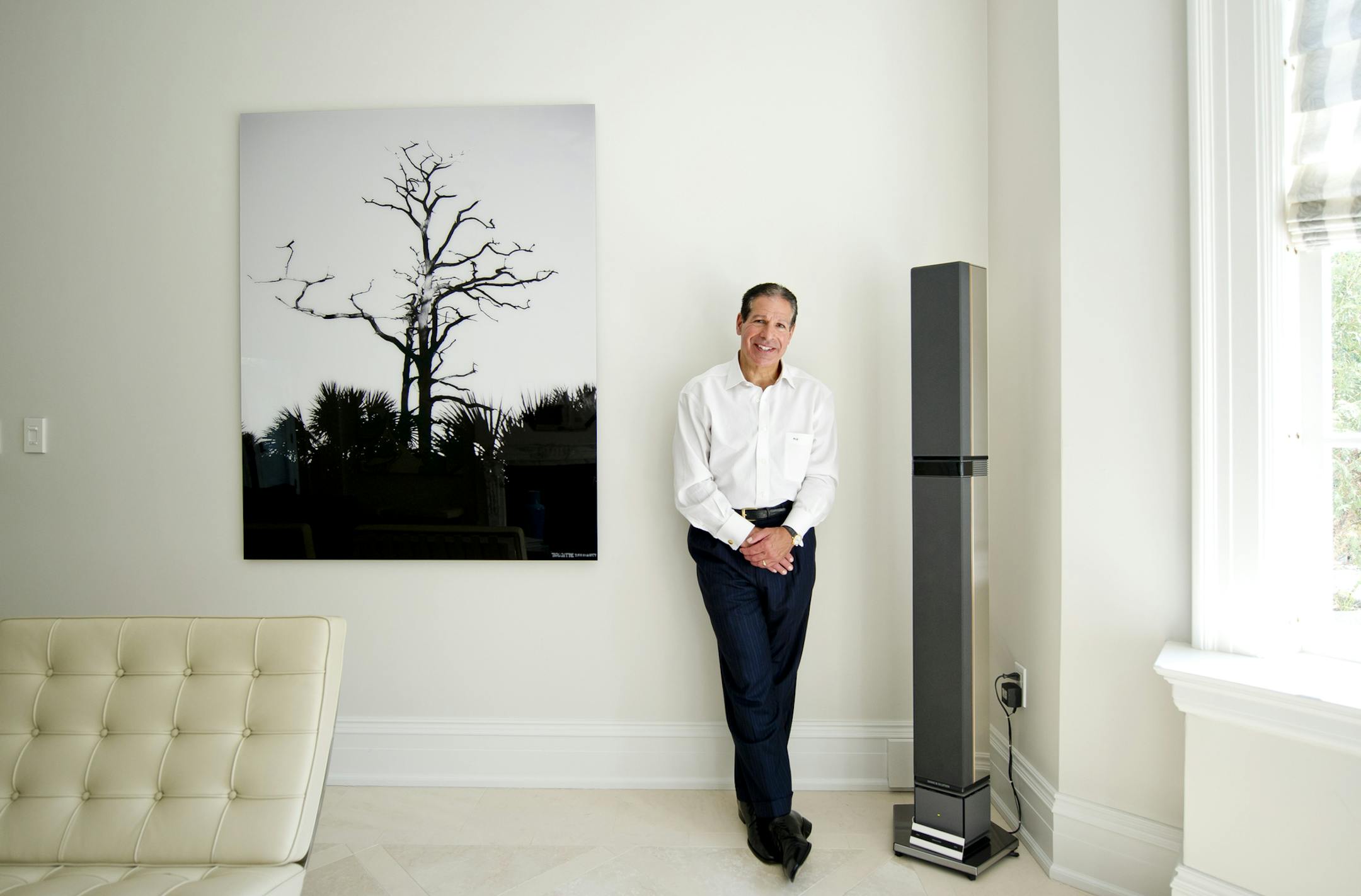 Philip Elias with a Bang & Olufsen Penta 3 tower speaker at his home in Pittsburgh, July 19, 2013. From the renewed popularity of vinyl to the sales explosion of high-end headphones, many younger music fans are seeking a listening experience that goes beyond an MP3 and a pair of earbuds. (Stephen McGee/The New York Times)