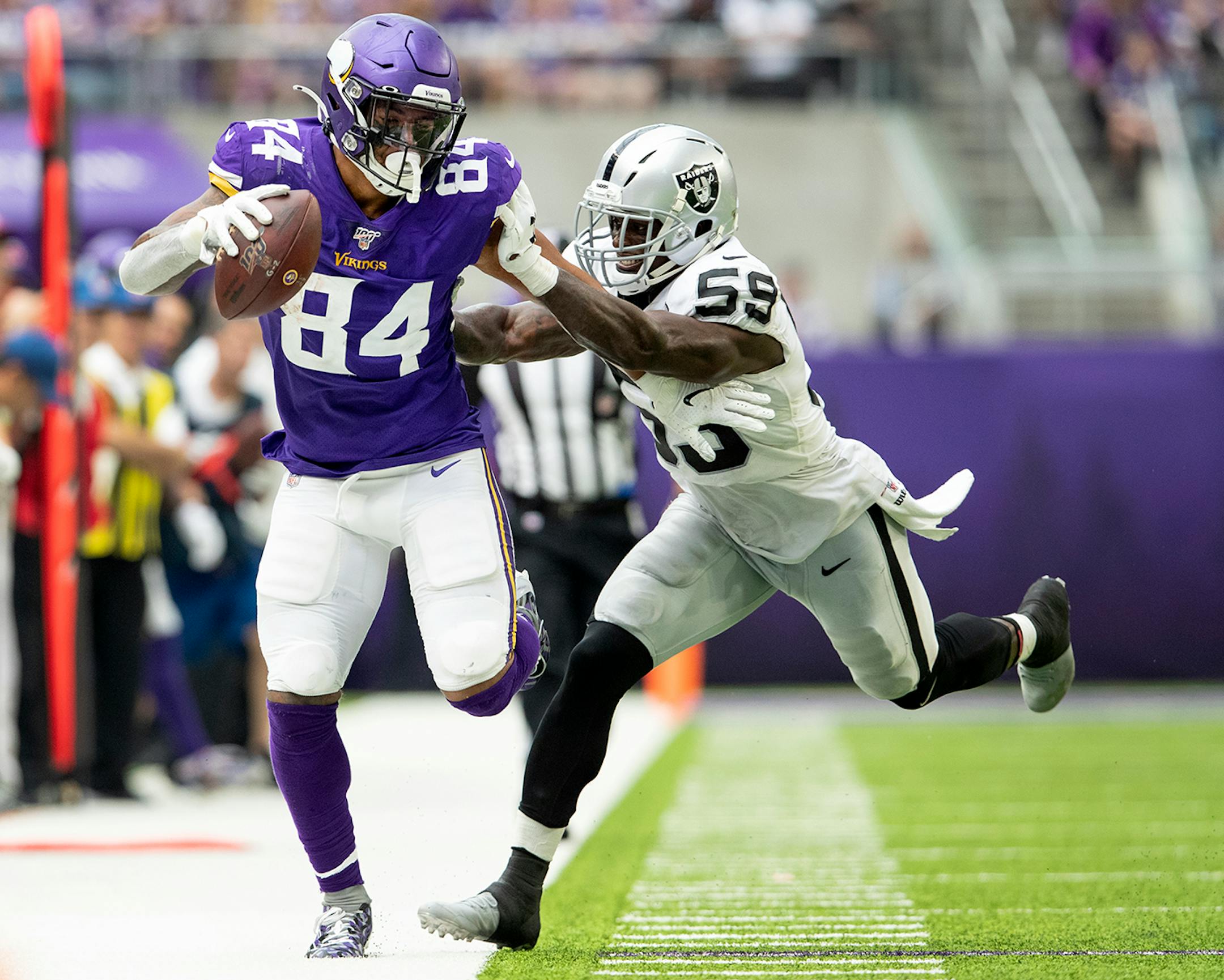 Minnesota Vikings' Irv Smith Jr. (84) was pushed out of bounds in the third quarter.