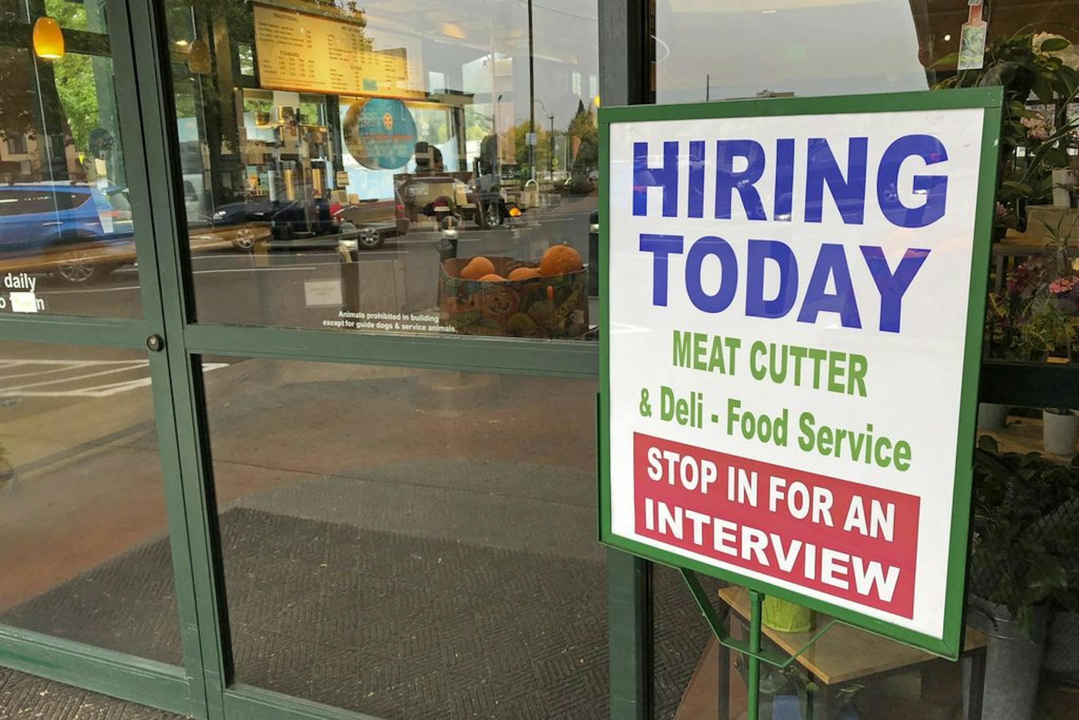 A sign that reads "hiring today," is shown at a grocery store in Olympia, Wash., advertising a job opportunity for a meat cutter on Oct. 3, 2020. On Thursday, Oct. 22, the number of Americans seeking unemployment benefits fell last week to 787,000, a sign that job losses may have eased slightly but are still running at historically high levels.