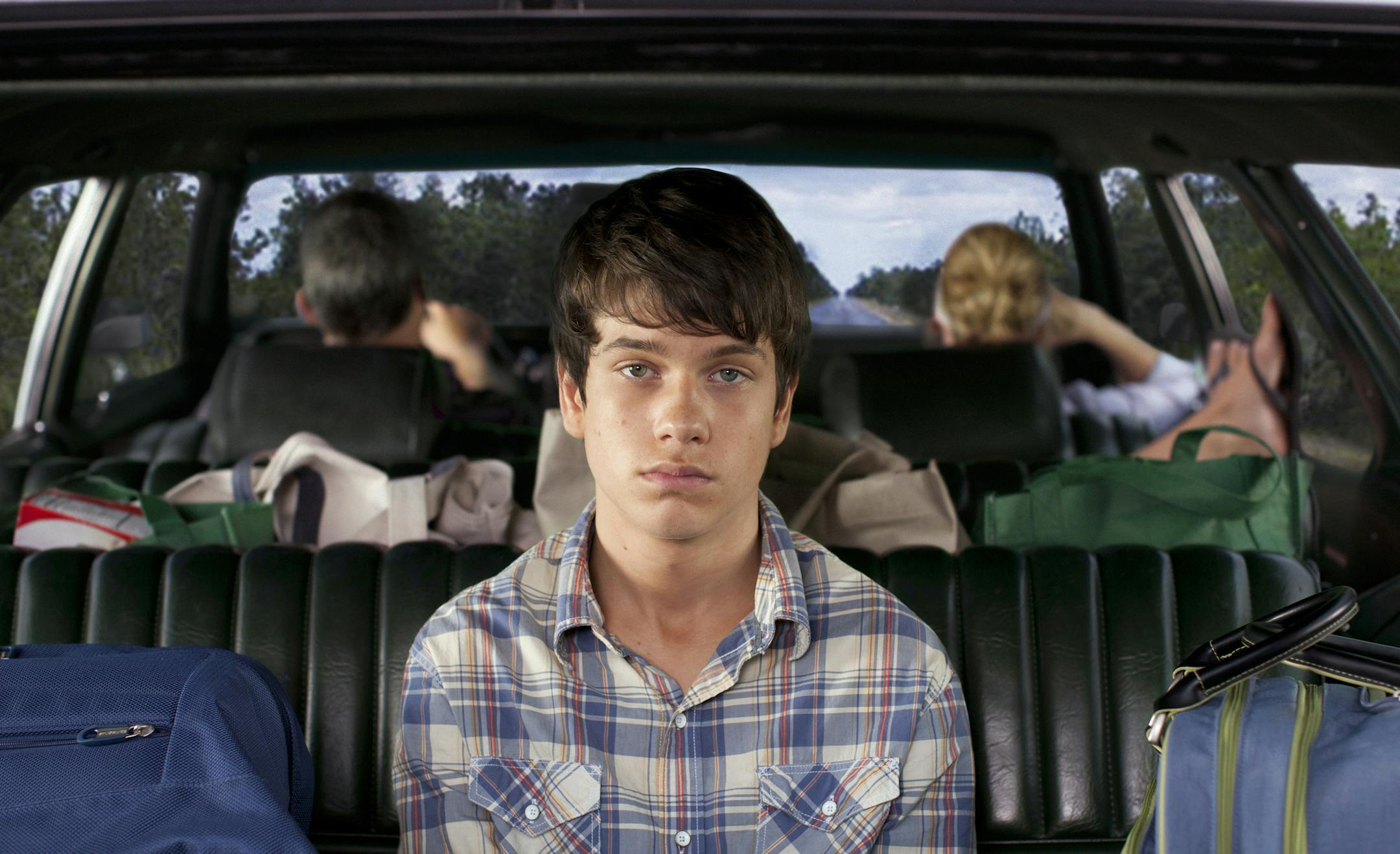 This publicity photo released by Fox Searchlight shows Liam James, front, and, rear from left, Steve Carell andToni Collette, in a scene from the film, "The Way, Way Back." (AP Photo/Fox Searchlight, Claire Folger) ORG XMIT: MIN2013070514124987