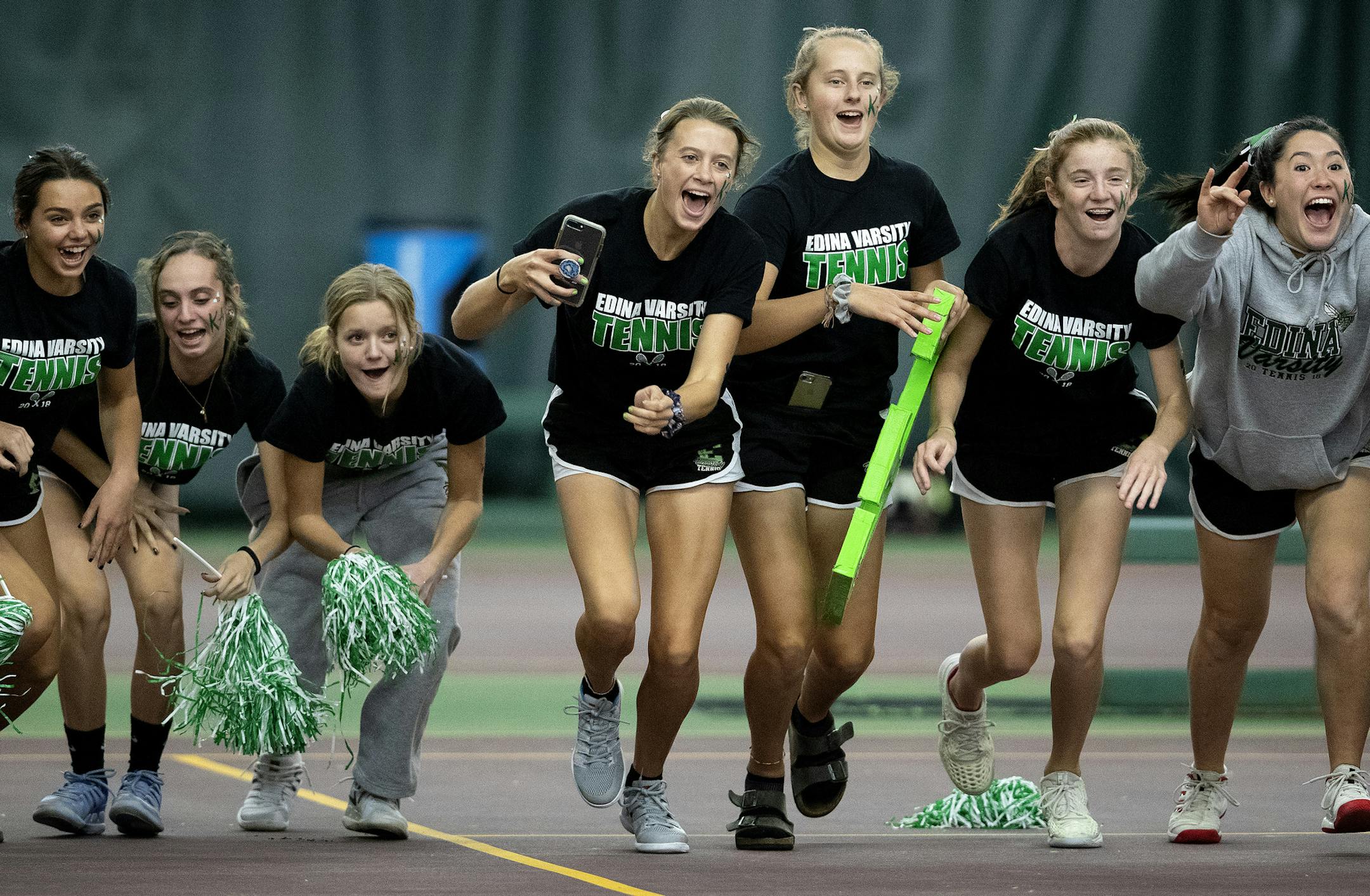 Edina players charged Nicole Copeland after her singles win. ] CARLOS GONZALEZ ï cgonzalez@startribune.com ñ October 24, 2018, Minneapolis, MN, Baseline Tennis Center, High School / Prep team tennis finals