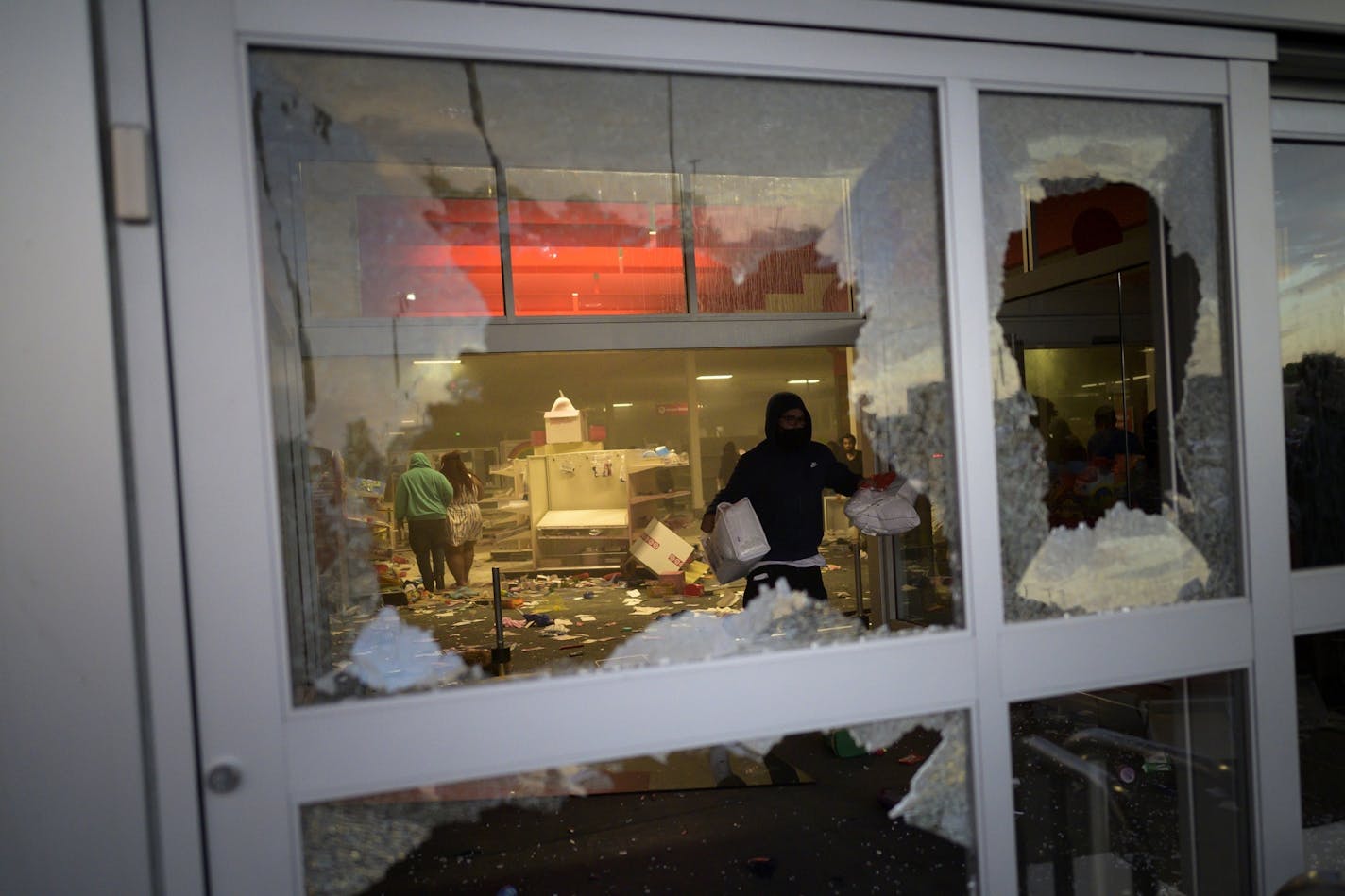 Looters made off with Target merchandise in Minneapolis on Wednesday, May 27, 2020, amid demonstrations against the death of George Floyd in a confrontation with Minneapolis police..