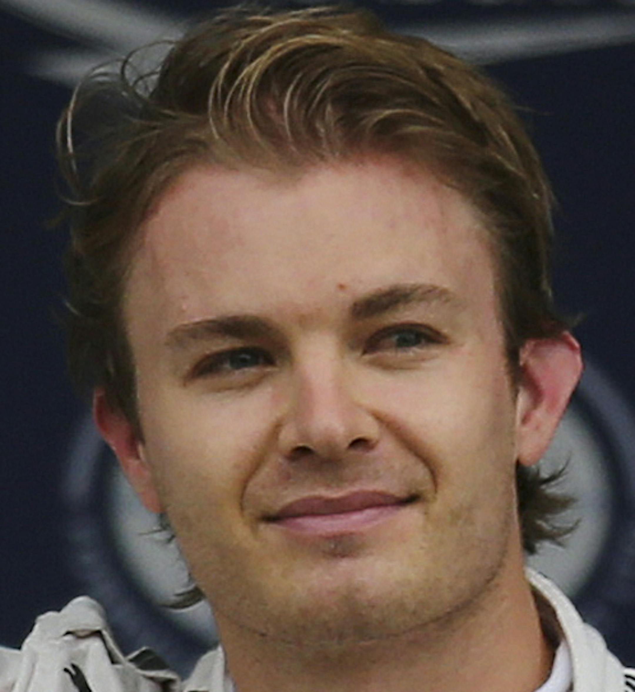 Mercedes drivers Nico Rosberg of Germany waves at the parc ferme after taking pole position in the qualifying session for the Japanese Formula One Grand Prix at the Suzuka Circuit in Suzuka, central Japan, Saturday, Sept. 26, 2015. (AP Photo/Rob Griffith)