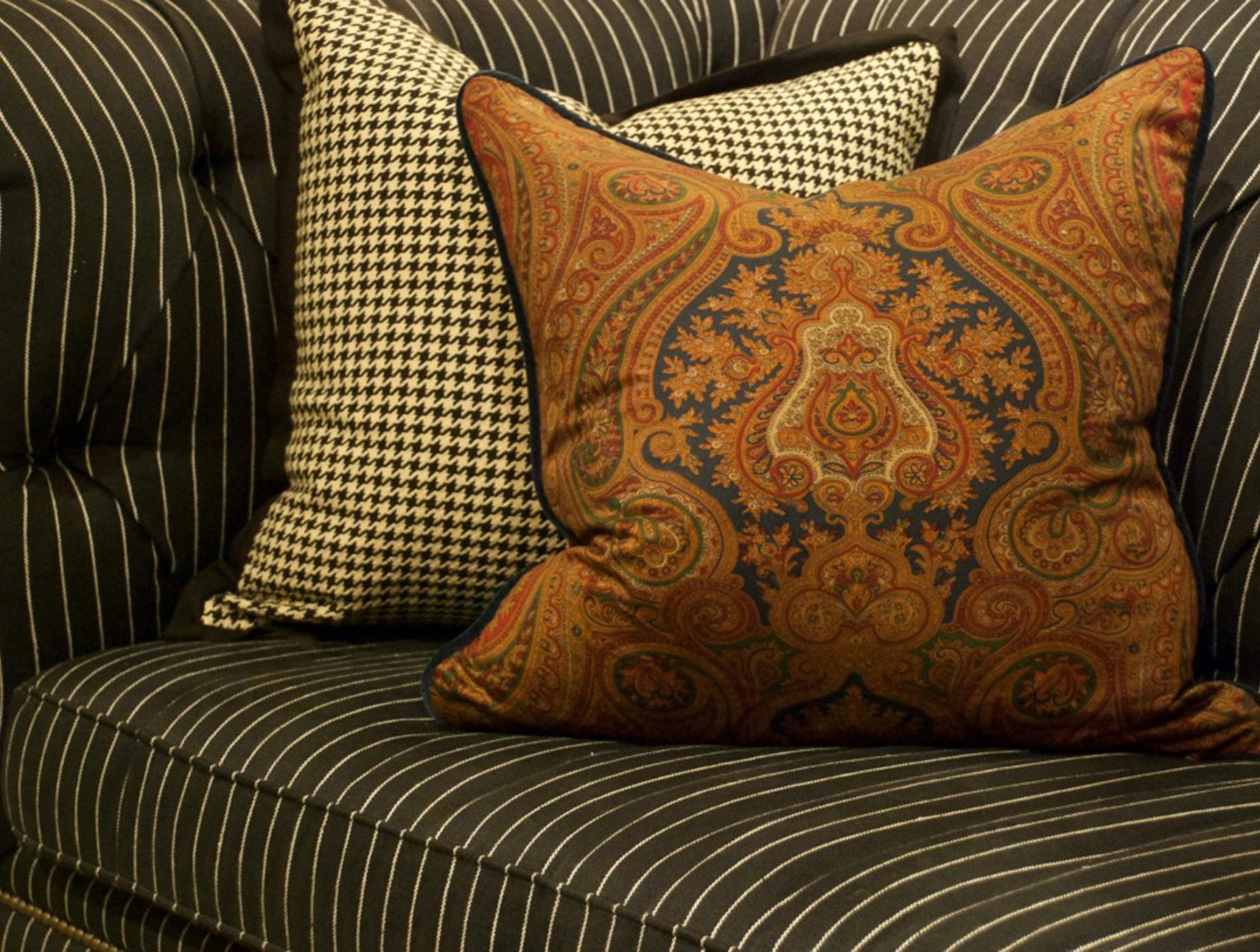 Plaid pillows in some of fall's most sensuous shades of olive, rust and camel. (Handout/TNS) ORG XMIT: 1190561