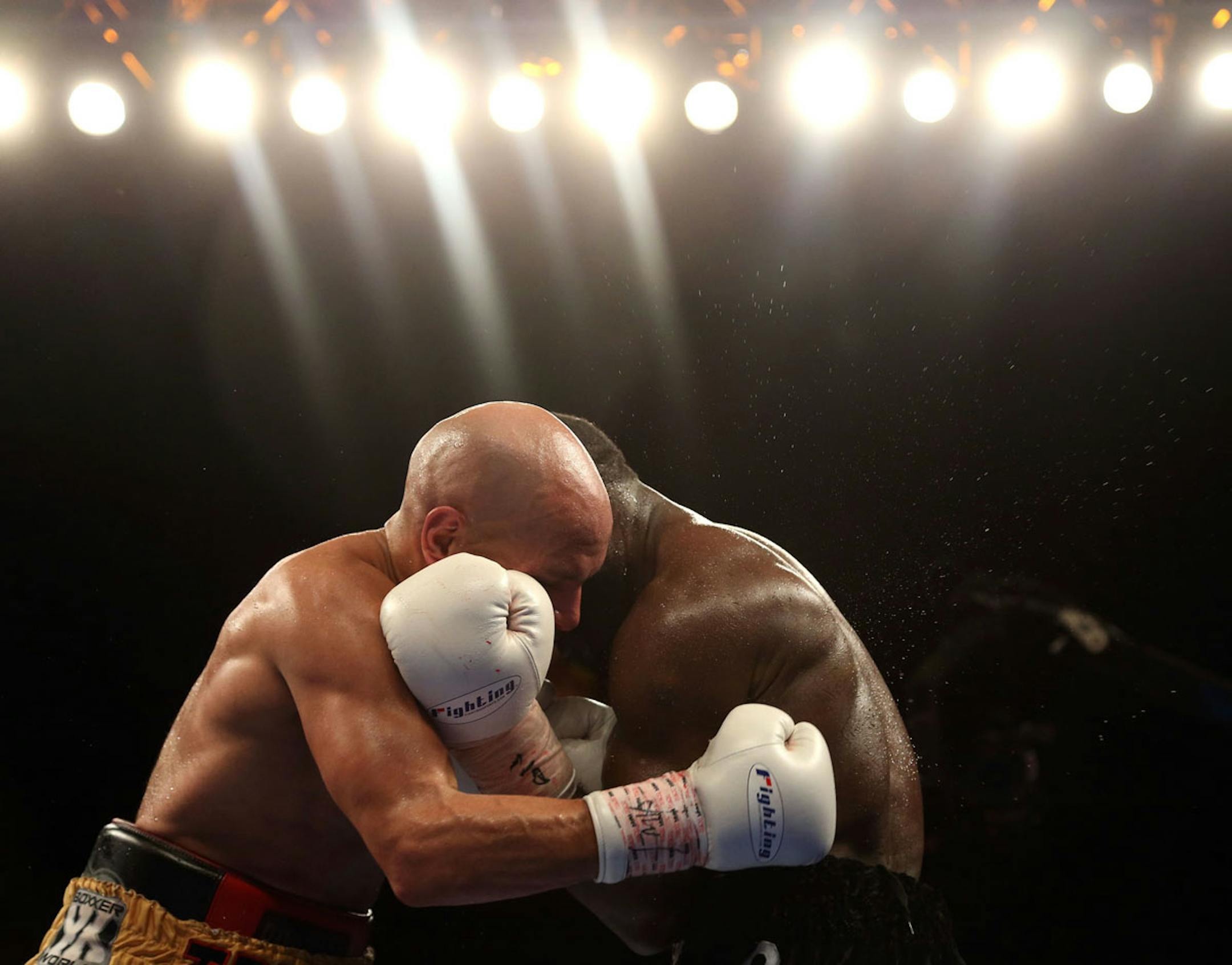 Ossie Duran aka - The Ghanaian Gladiator and USBA Middleweight Champion Caleb Truax, of Osseo, Minnesota clenched during a semi final fight at Target Center in Minneapolis Friday, January 3, 2014. The bout ended in a tie 95-95. ] (KYNDELL HARKNESS/STAR TRIBUNE) kyndell.harkness@startribune.com