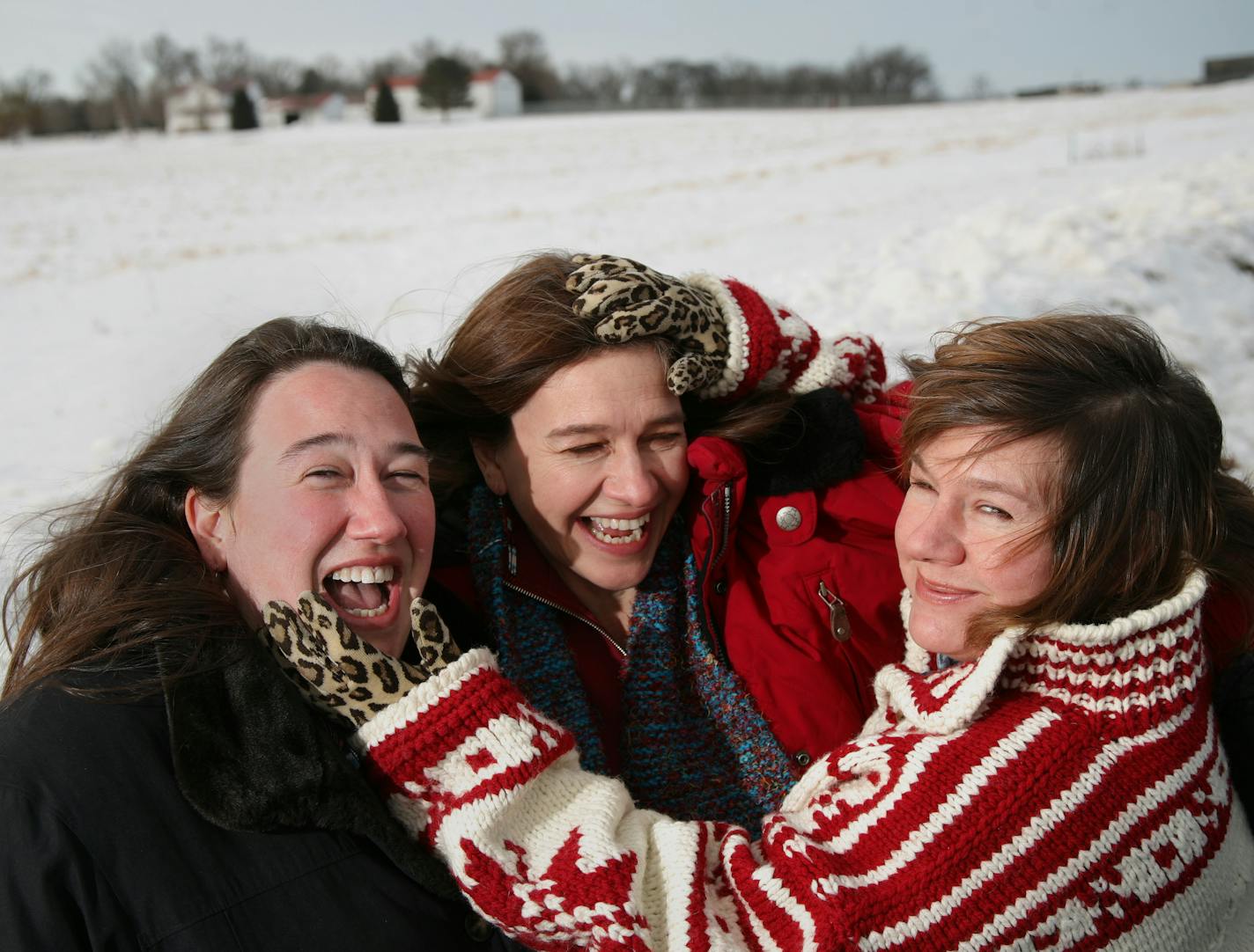 TOM WALLACE�twallace@startribune.com
Assign#00001144A Slug: books01xx
The three Erdrich sisters, from left, Heid, Louise and Lise enjoy a moment together during a photo shoot out on the farmland of western Minnesota, halfway from Minneapolis, MN and Waupton, ND. They had met at Charlie's Caf� in Freeport for an interview with the Star Tribune.