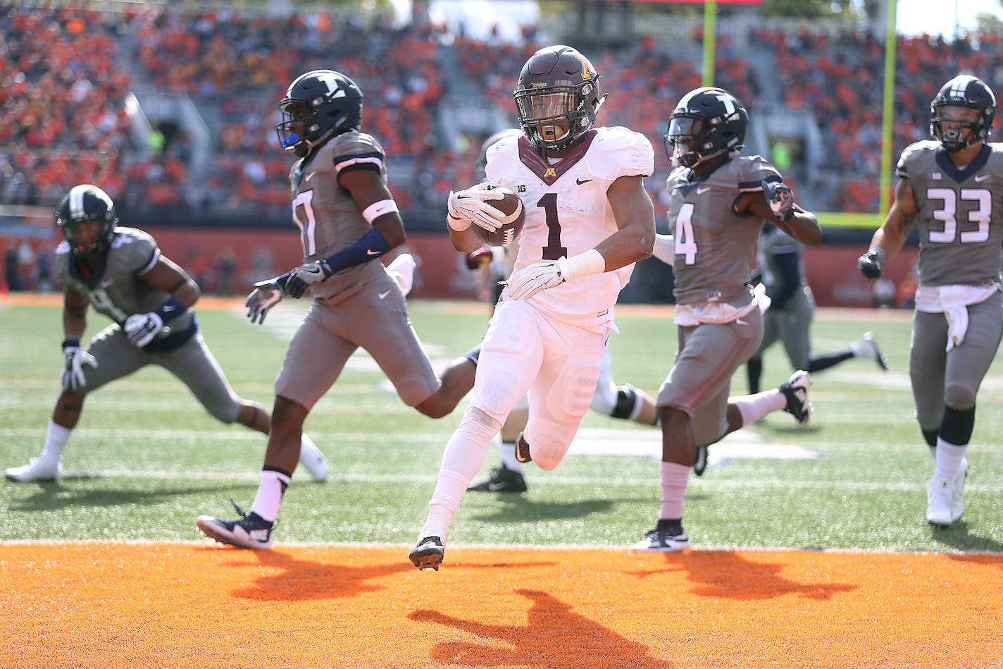 Minnesota's running back Rodney Smith ran the ball into the end zone for a touchdown during the third quarter Saturday against Illinois.