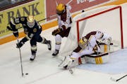 Gopher's goalie Adam Wilcox tried to block the shot of Notre Dame's Mario Lucia in 2014. The teams will be conference rivals beginning in 2017.