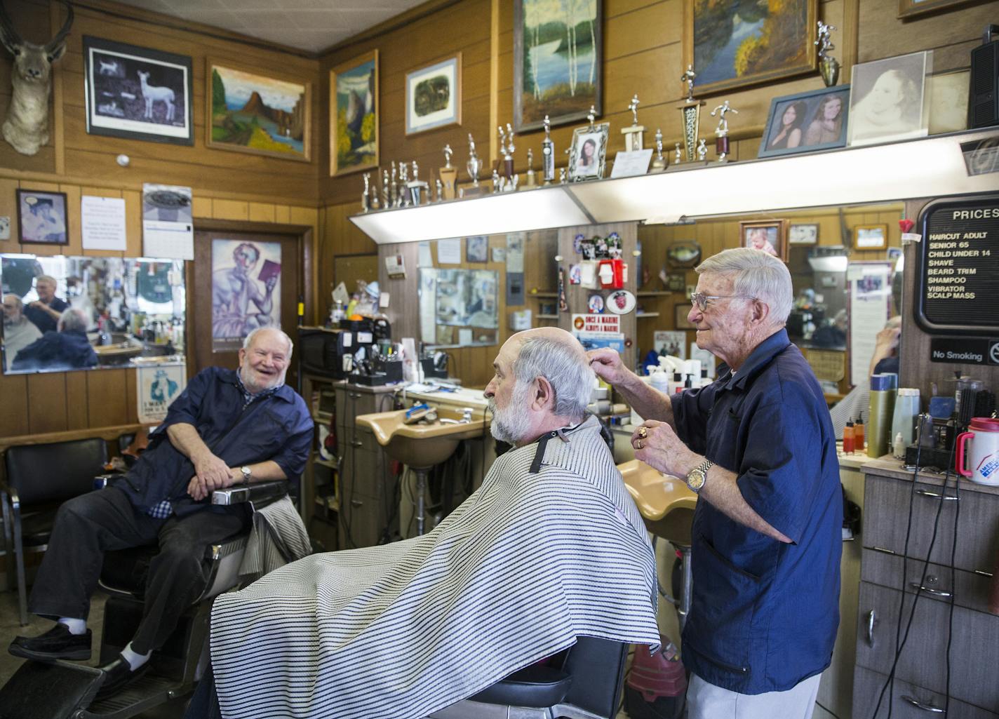 Jeff&#x2019;s Barbershop has been a Hopkins mainstay for 30 years. Jeff DeLozier gives Doug Luthanen a haircut while brother Rich waits for his next customer.