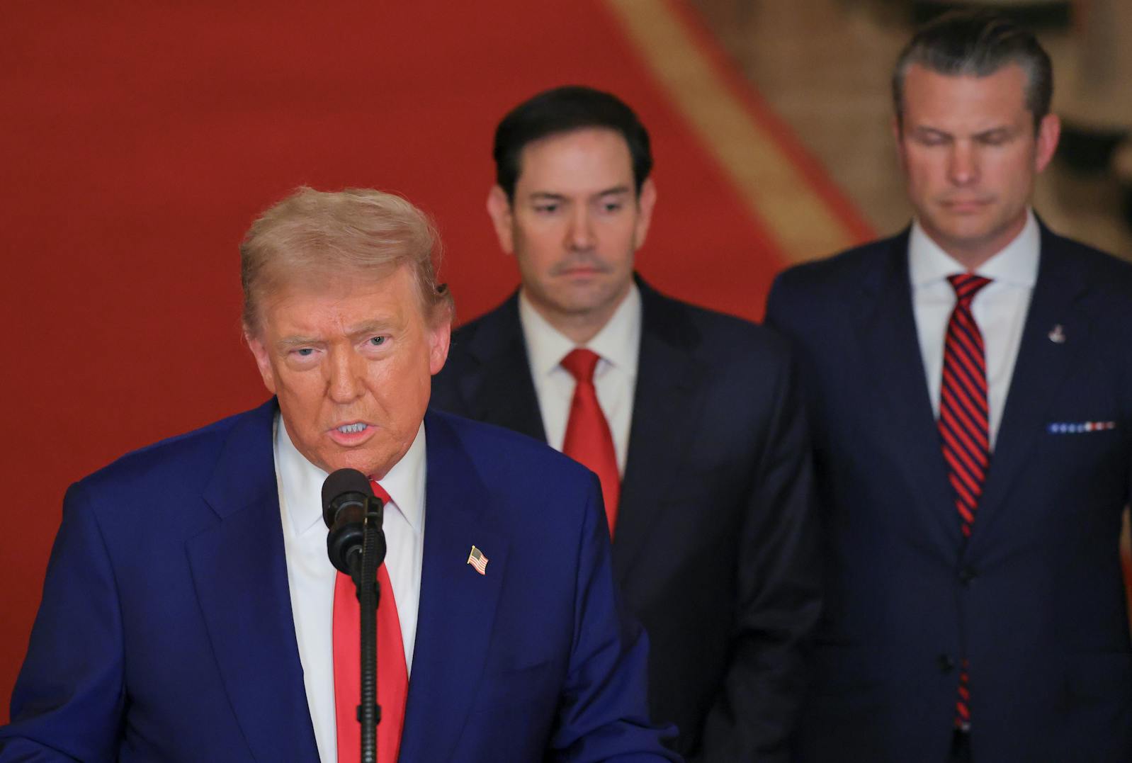 President Donald Trump speaks from the East Room of the White House in Washington, Saturday, June 21, 2025, after the U.S. military struck three Iranian nuclear and military sites, directly joining Israel's effort to decapitate the country's nuclear program, as Secretary of State Marco Rubio and Defense Secretary Pete Hegseth listen. (Carlos Barria/Pool via AP)
