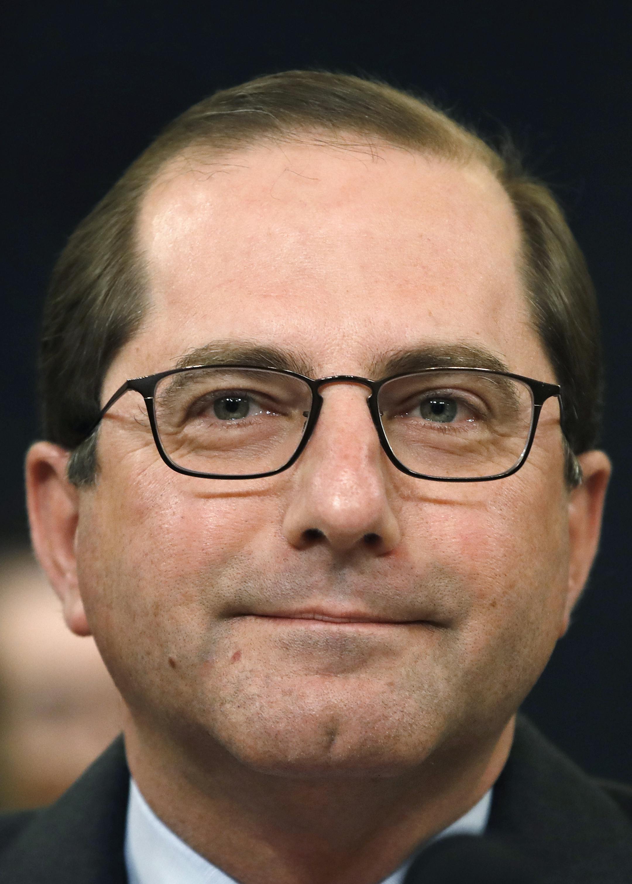 In this Feb. 14, 2018 photo, Health and Human Services Secretary Alex Azar attends a House Ways and Means Committee hearing on the FY19 budget on Capitol Hill in Washington. The Trump administration is clearing the way for a lower-cost alternative to comprehensive medical insurance plans sold under former President Barack Obama's health care law. (AP Photo/Jacquelyn Martin)