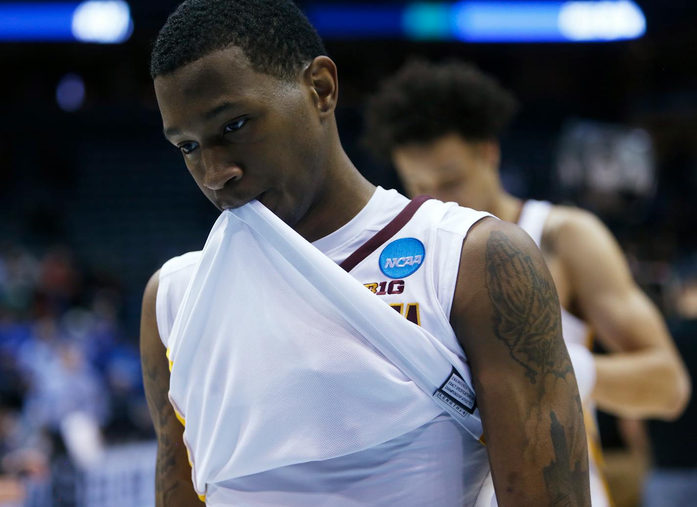 Minnesota's Dupree McBrayer walks off the court after an NCAA college basketball tournament first round game against Middle Tennessee State Thursday, March 16, 2017, in Milwaukee. Middle Tennessee State won 81-72. (AP Photo/Kiichiro Sato)