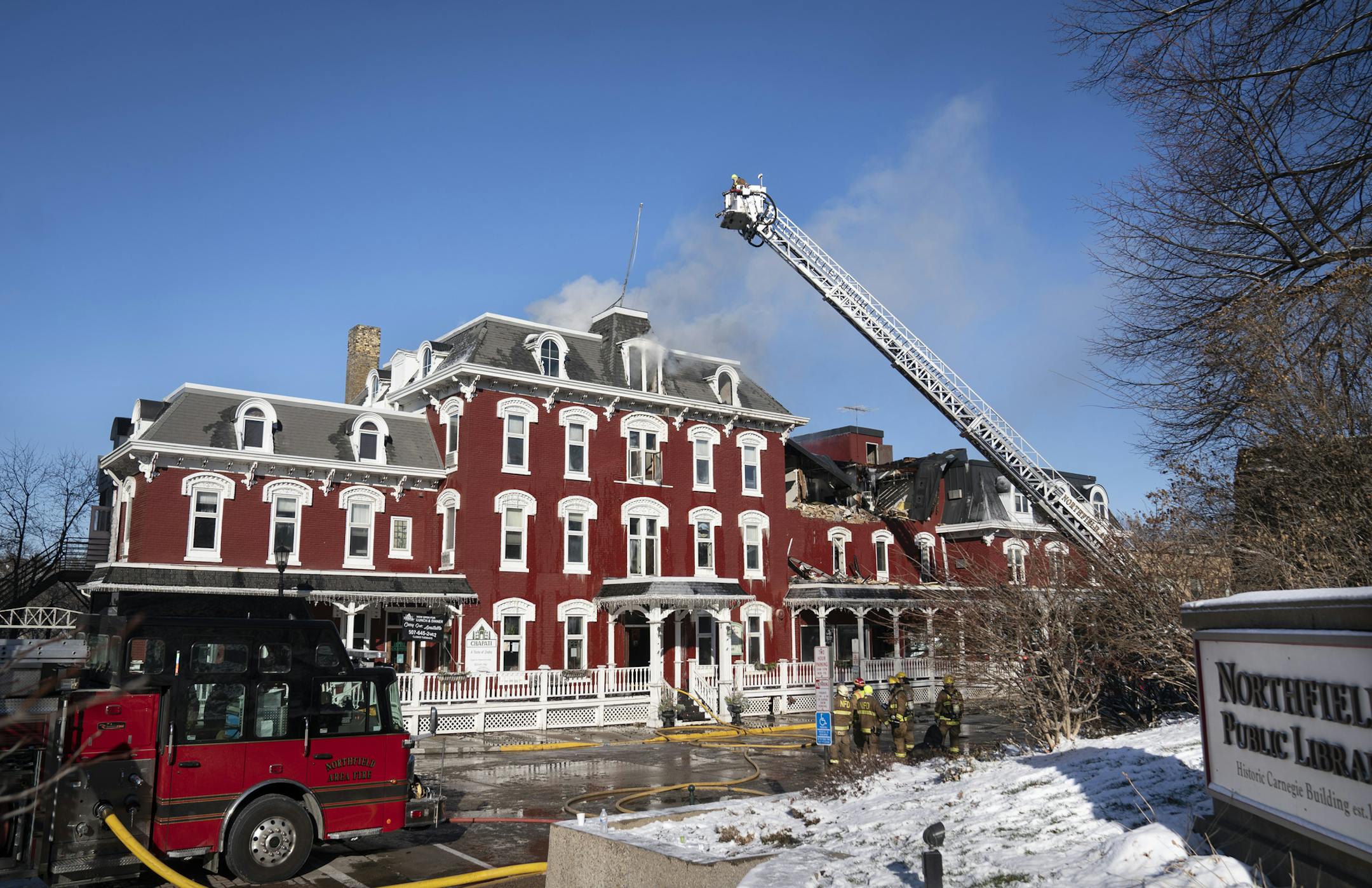 Firefighters worked to put out a fire that started on Thursday that heavily damaged the Archer House building in downtown in Northfield, Minn. Photographed on Friday, November 13, 2020. It continued to burn Friday morning and the 143-year-old building was judged likely a total loss. ] RENEE JONES SCHNEIDER renee.jones@startribune.com