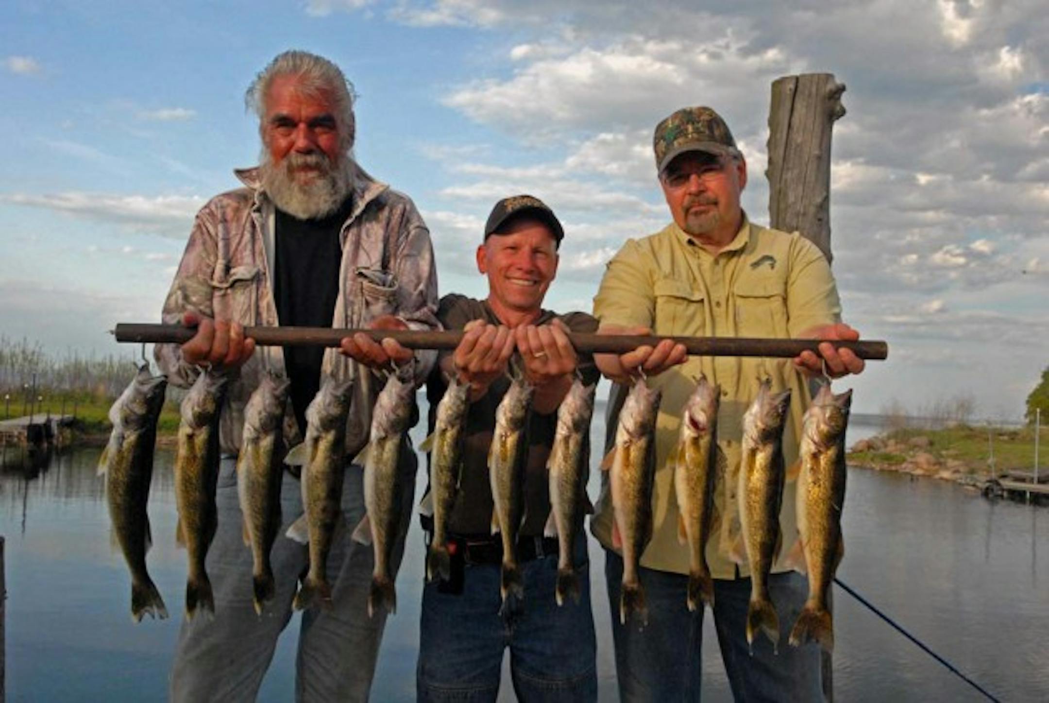 Dick (Griz) Grzywinski, left, Larry Blaske and Terry Thurmer, owner of Terry's Boat Harbor on Mille Lacs, with limits of keeper walleyes taken last week on Mille Lacs.