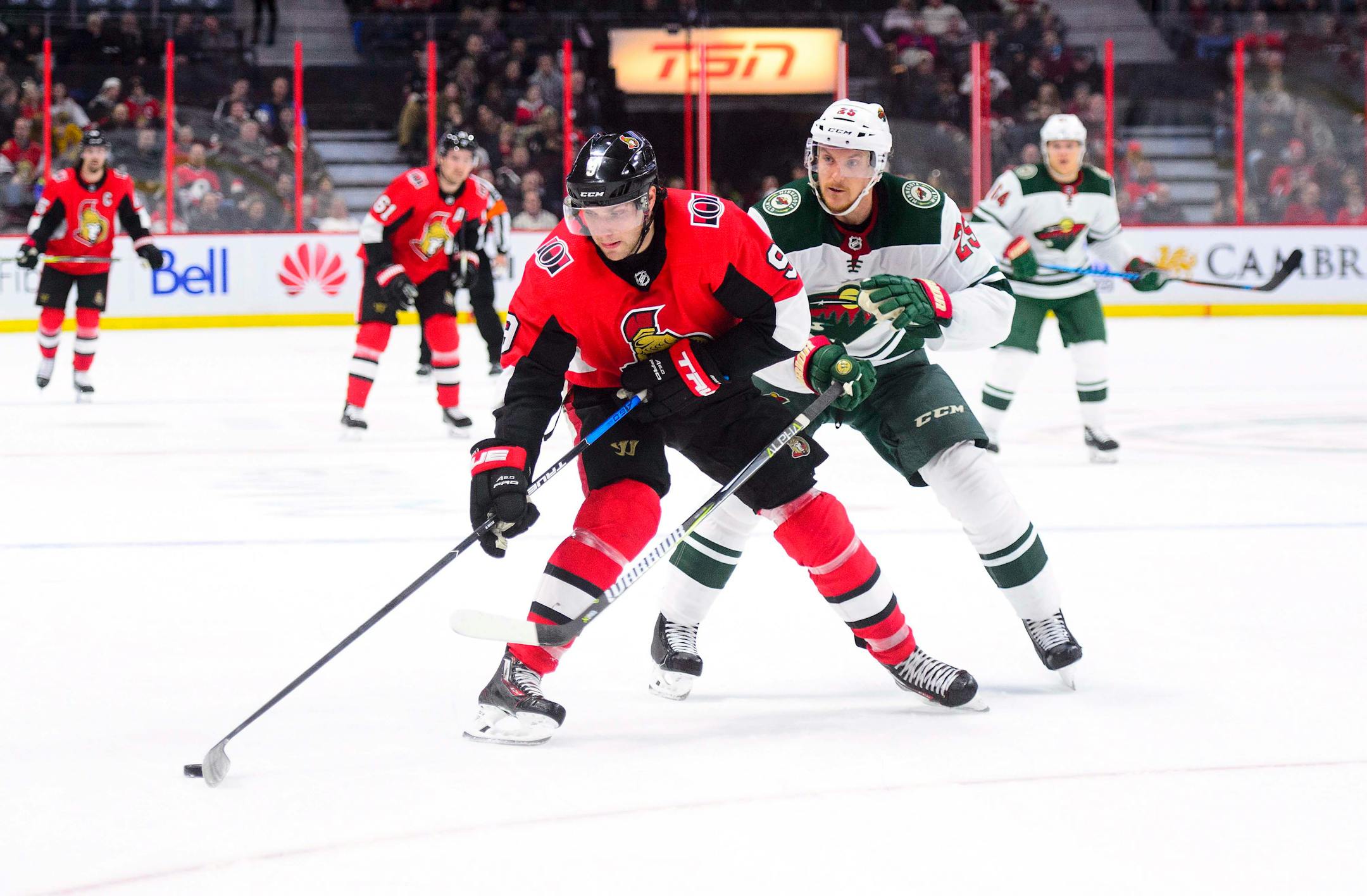 Ottawa Senators' Bobby Ryan moves the puck past Minnesota Wild's Jonas Brodin during second period NHL hockey action in Ottawa on Tuesday, Dec. 19, 2017. (Sean Kilpatrick/The Canadian Press via AP)