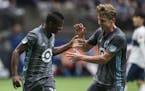 Minnesota United's Carlos Darwin Quintero (25) celebrates his goal with Rasmus Schuller during the first half of an MLS soccer match against the Vanco