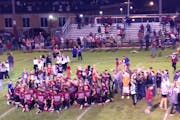 Moments after the Staples-Motley Cardinals broke a 39-game losing streak on Friday, fans stormed the football field to celebrate a 24-14 victory, last