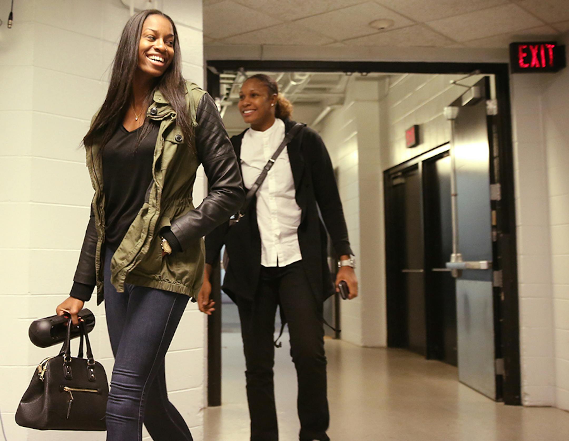 Minnesota Lynx forward Devereaux Peters (14), left, and Minnesota Lynx forward Rebekkah Brunson (32) arrive at Target Center before the game.