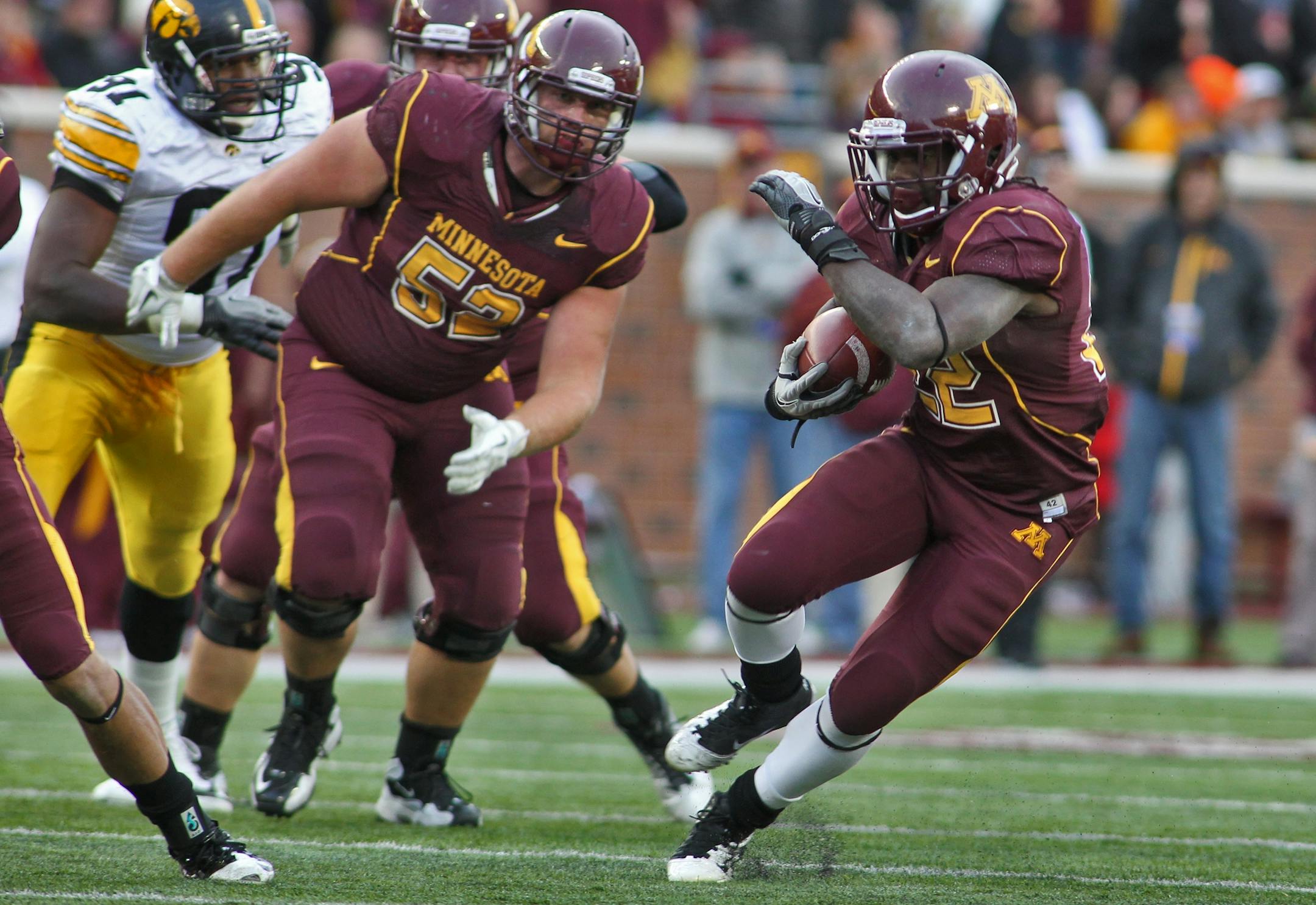 Gophers running back Duane Bennett, shown during the upset victory over Iowa, has surpassed 100 yards rushing in two of the past four games thanks in large part to the work of young offensive linemen such as right guard Zac Epping (52).