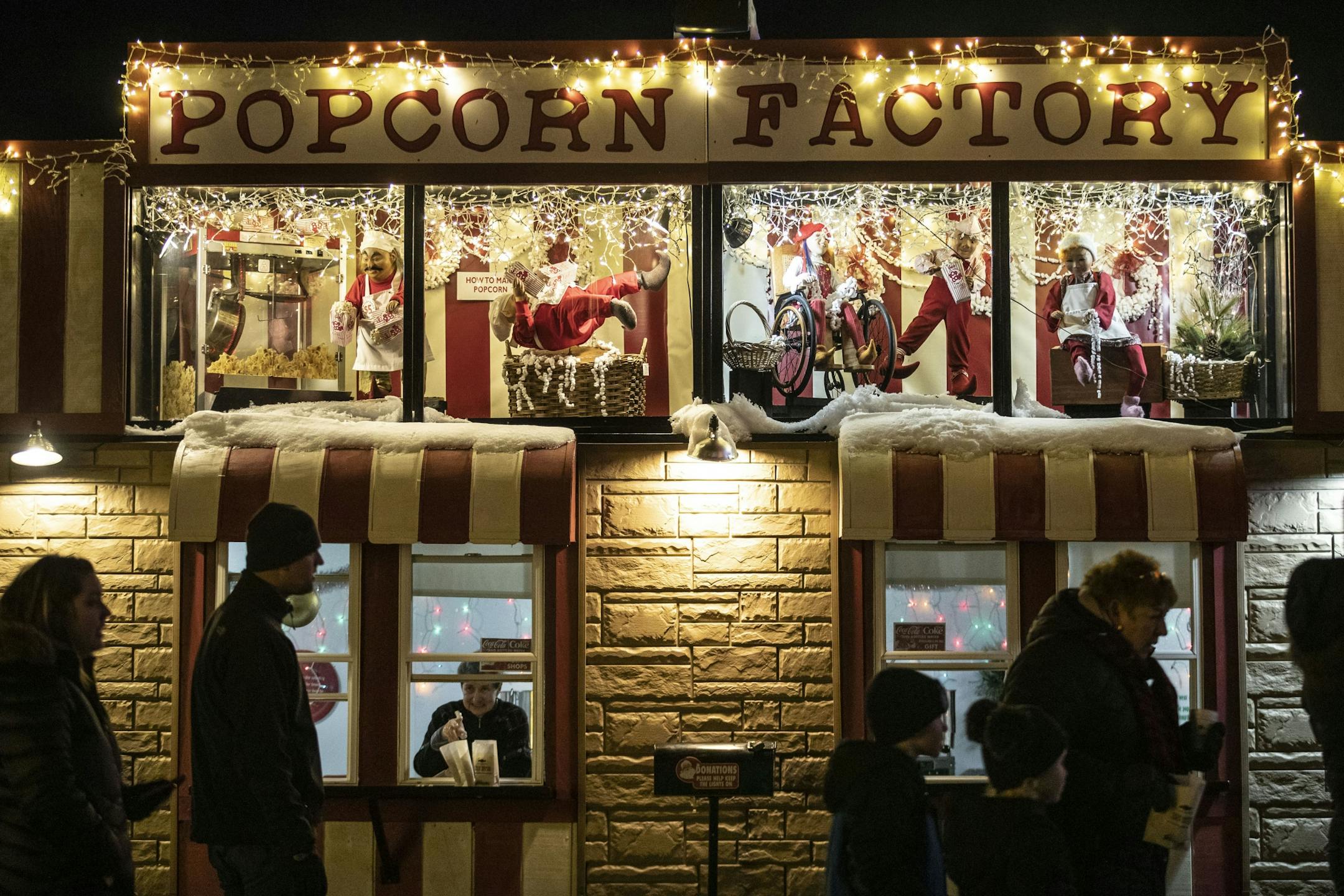 Visitors walked by and visited the popcorn stand in Bentleyville where animatronic elves making popcorn moved and came to life on Tuesday December 3, 2019.