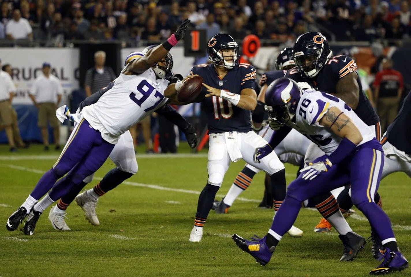 Minnesota Vikings defensive end Everson Griffen (97) strips the ball from Chicago Bears quarterback Mitchell Trubisky (10) during the first half of an NFL football game, Monday, Oct. 9, 2017, in Chicago.